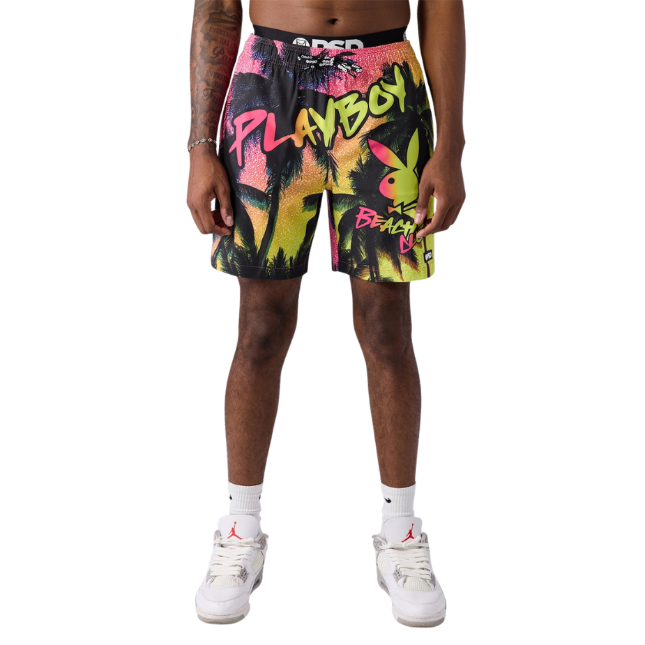 Playboy-themed shorts worn by a person on a white background
