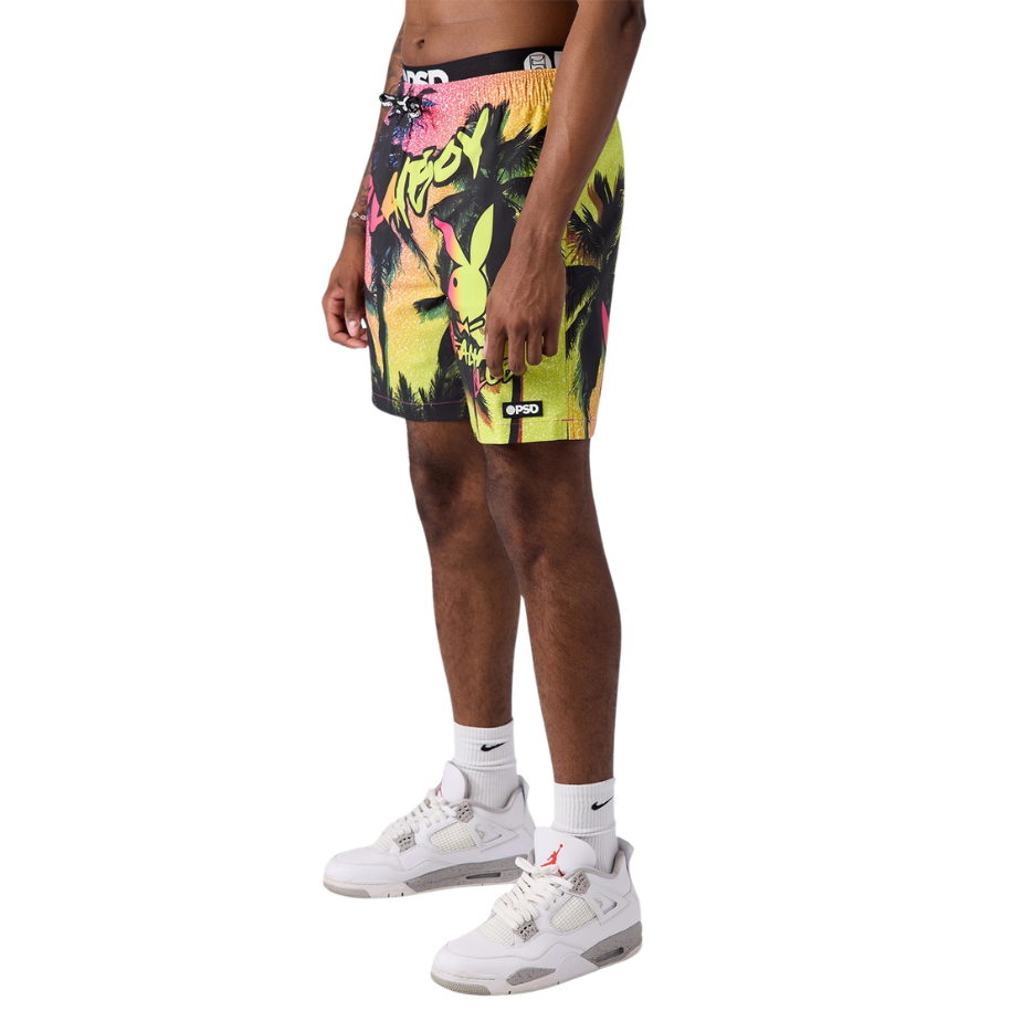 Person wearing colorful shorts with a brand logo on a white background