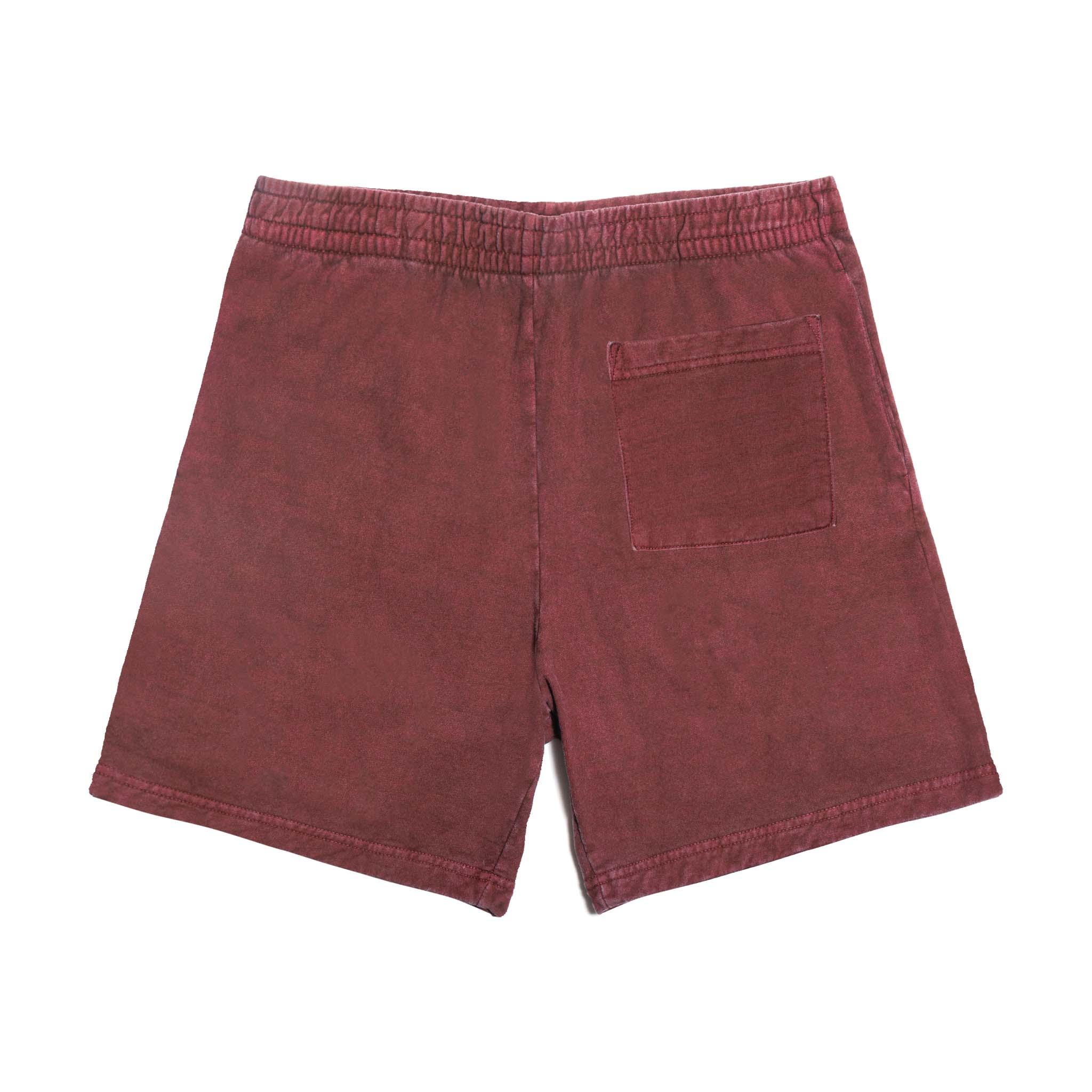 Back view of maroon sweatshorts with elastic waistband and single rear pocket on white background