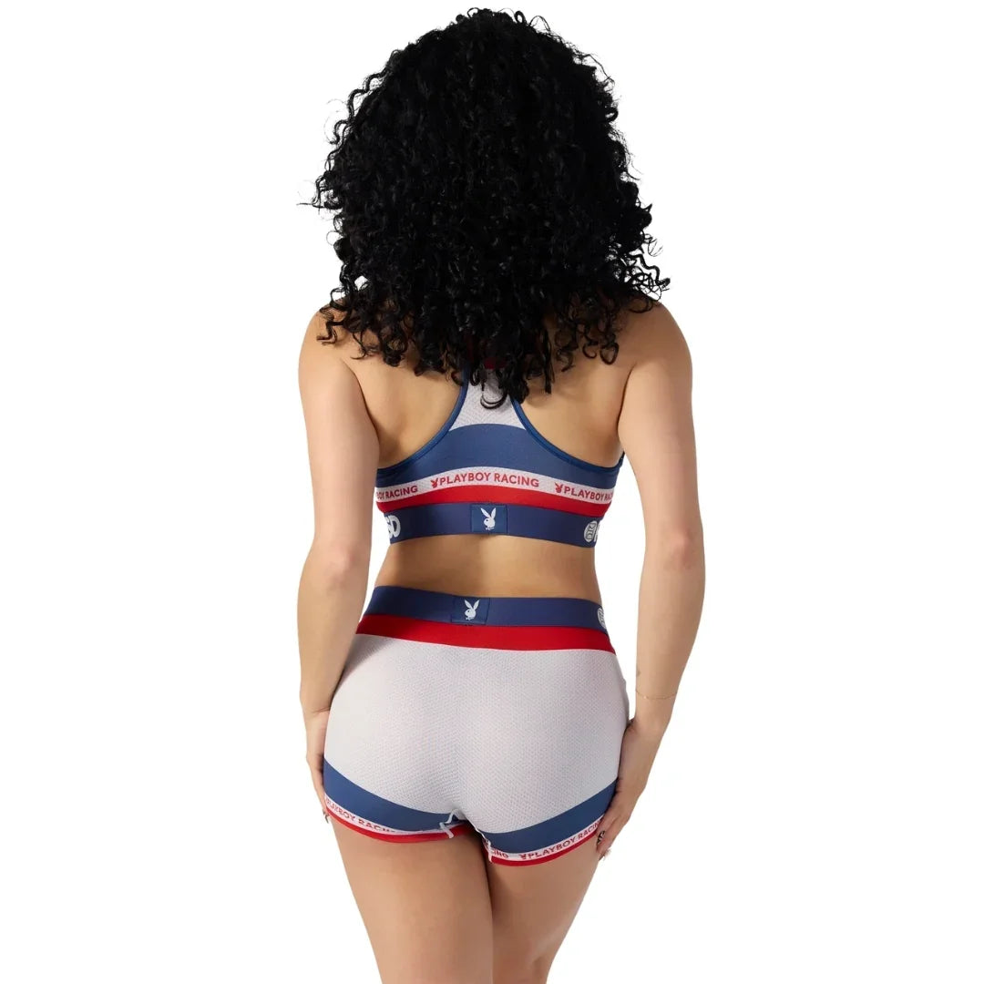 Woman in Playboy Racing athletic lingerie set with logo, shown from the back on white background