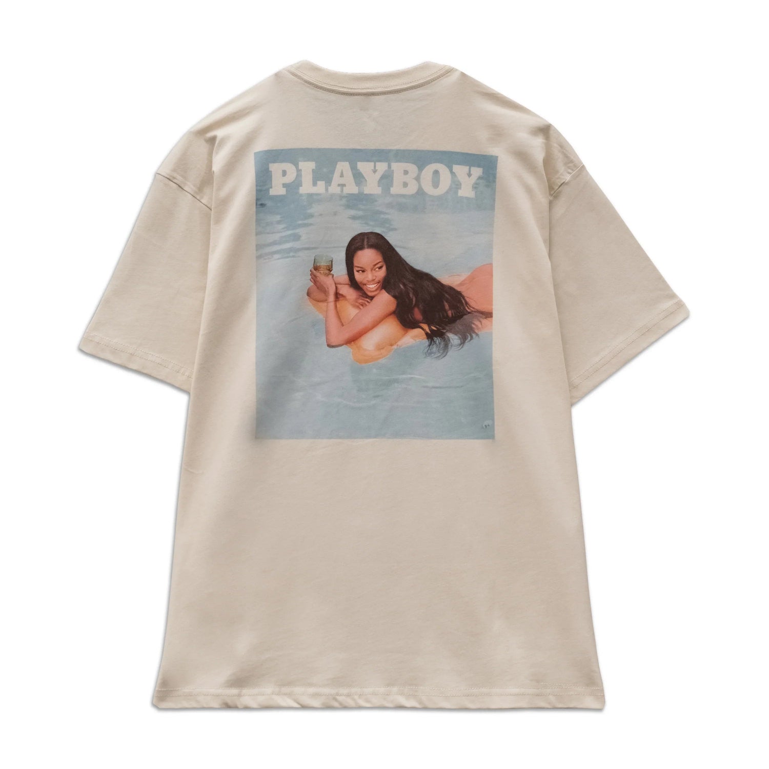 Beige graphic tee with a back print of a woman in a pool and PLAYBOY text above.