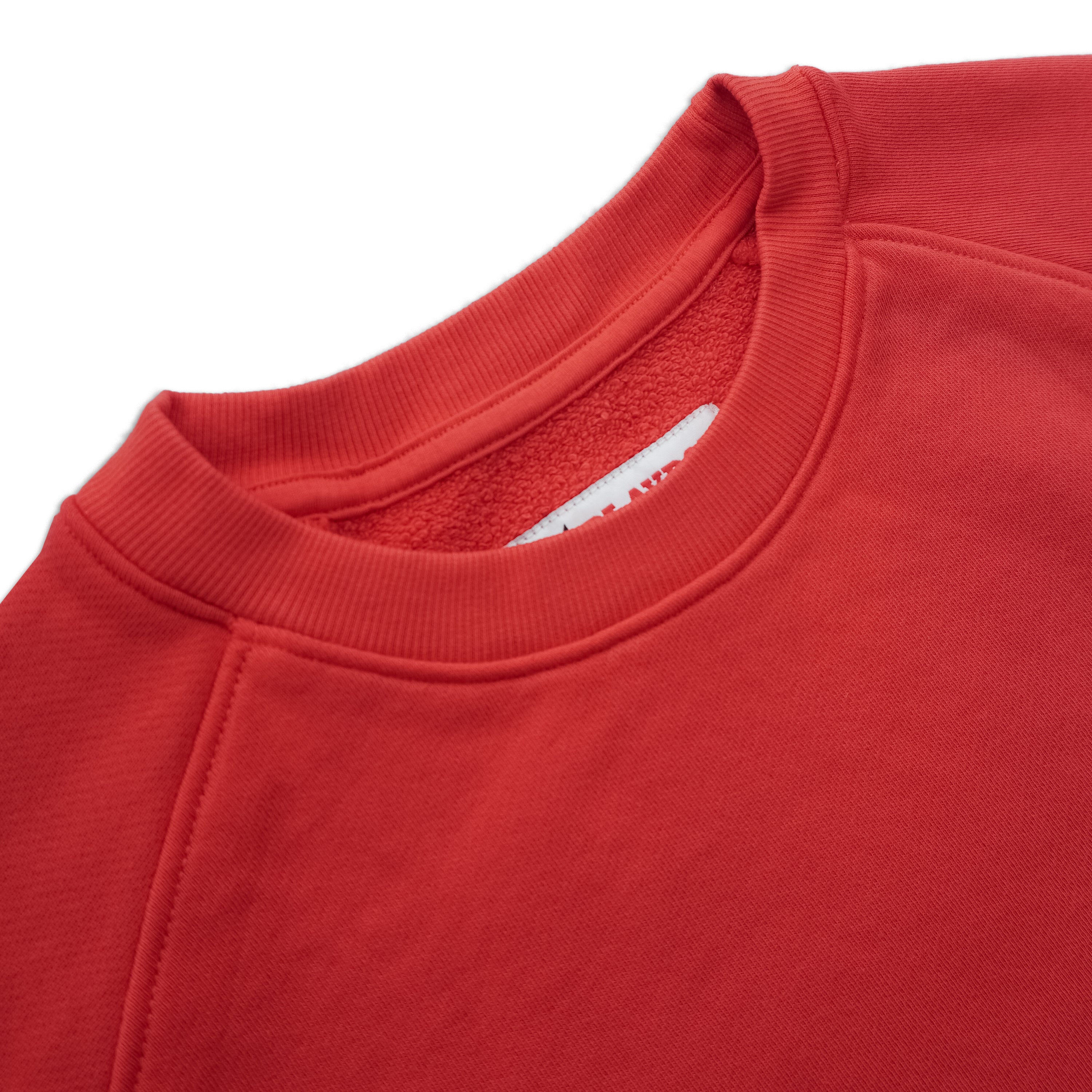 Close-up of red crewneck sweatshirt with ribbed collar and soft fabric texture
