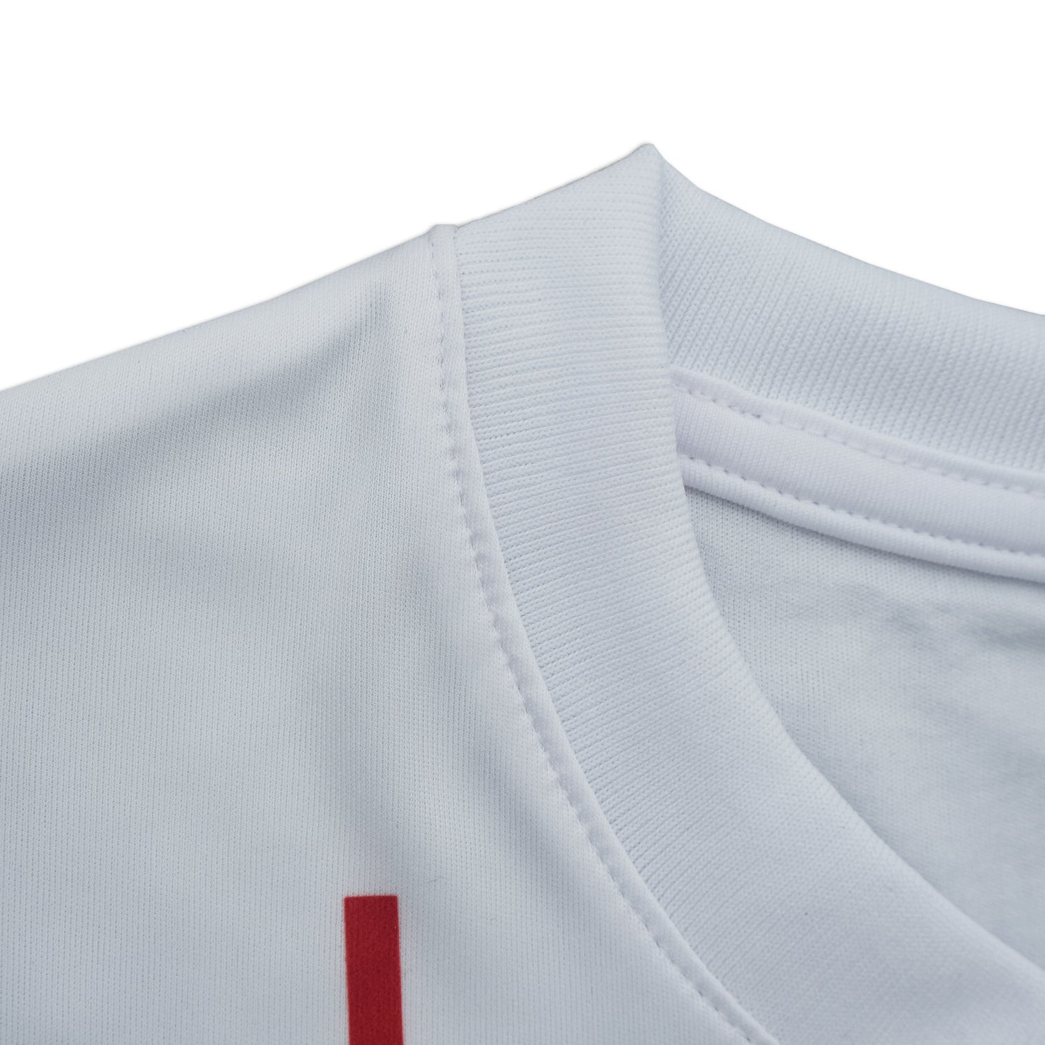 Close-up of a light gray shirt with a red logo on a white background