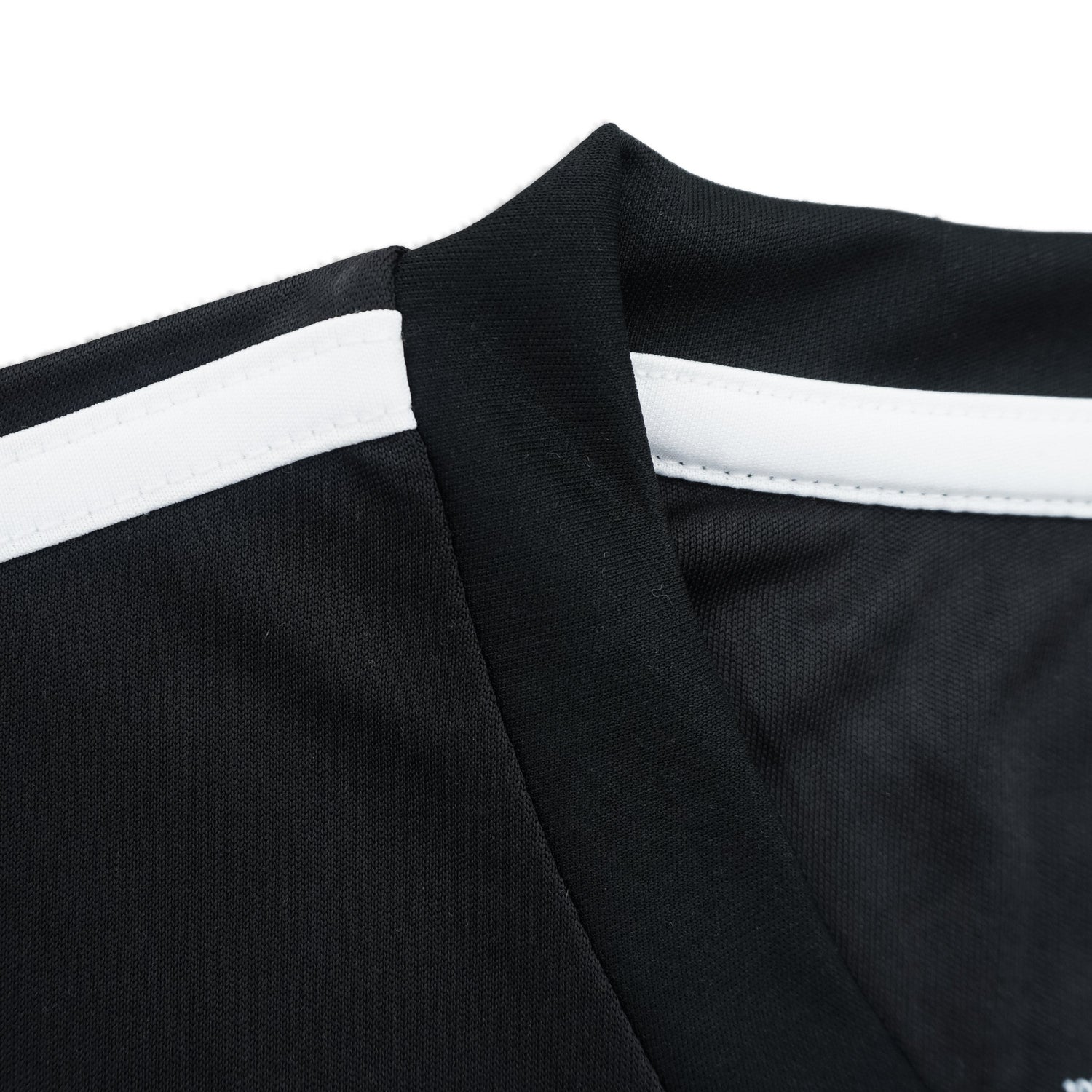 Close-up of black fabric with white stripes on a white background