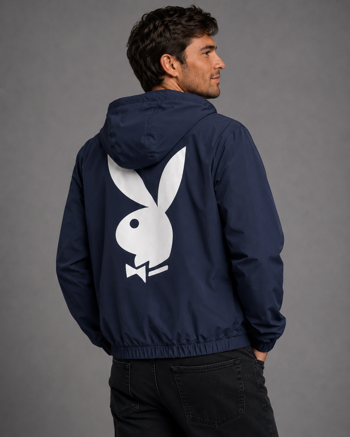 A man wearing a navy blue hooded jacket, shown from the back. The jacket features a large white Playboy bunny logo on the back.