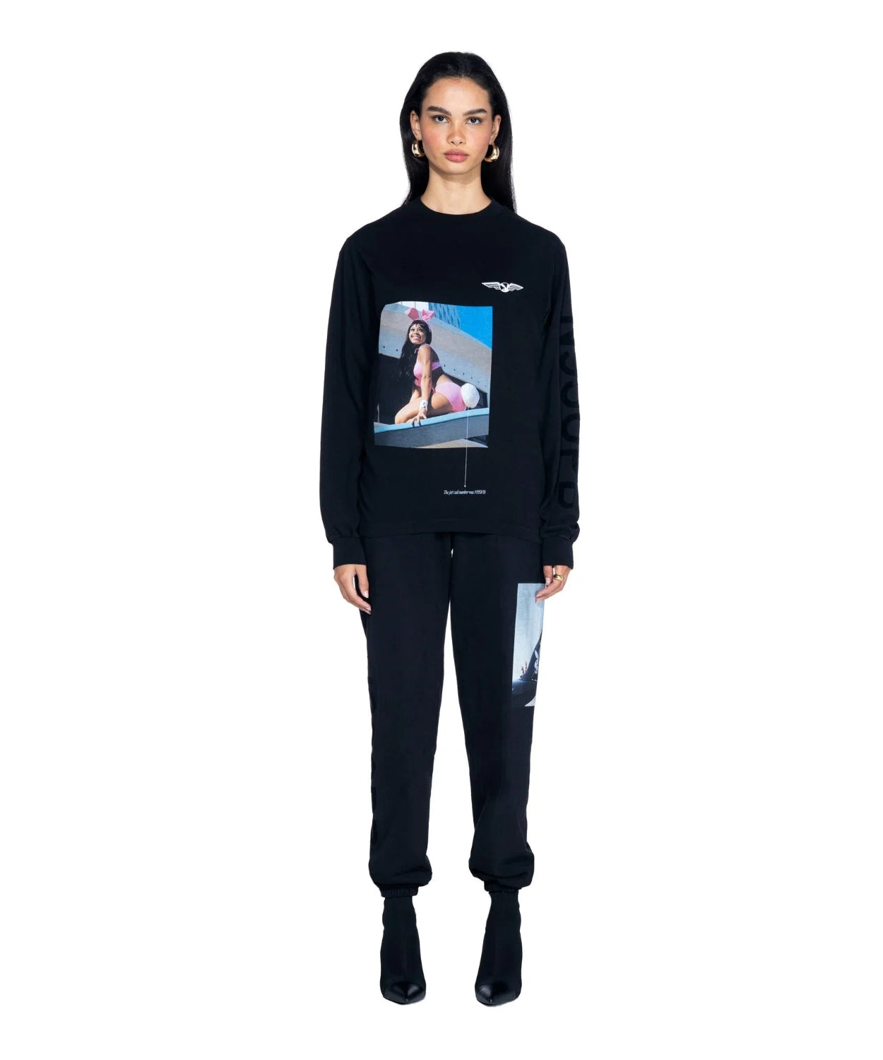 Woman wearing black long sleeve t-shirt with aviation wings and model photo graphic print