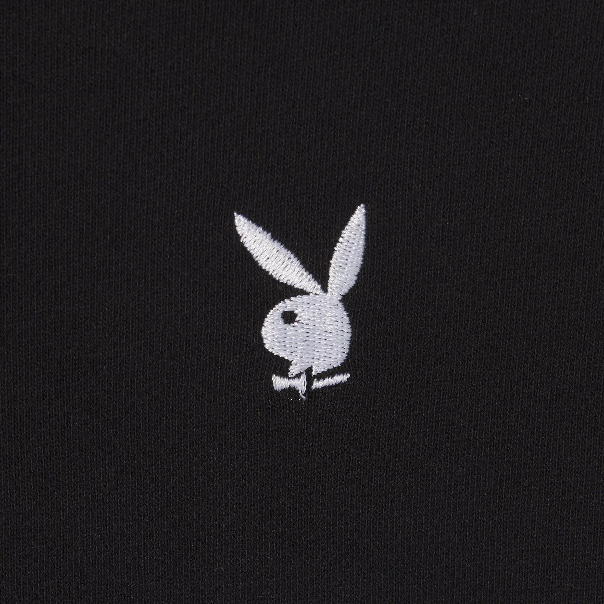 Black crewneck sweatshirt with white bunny head embroidery on fabric