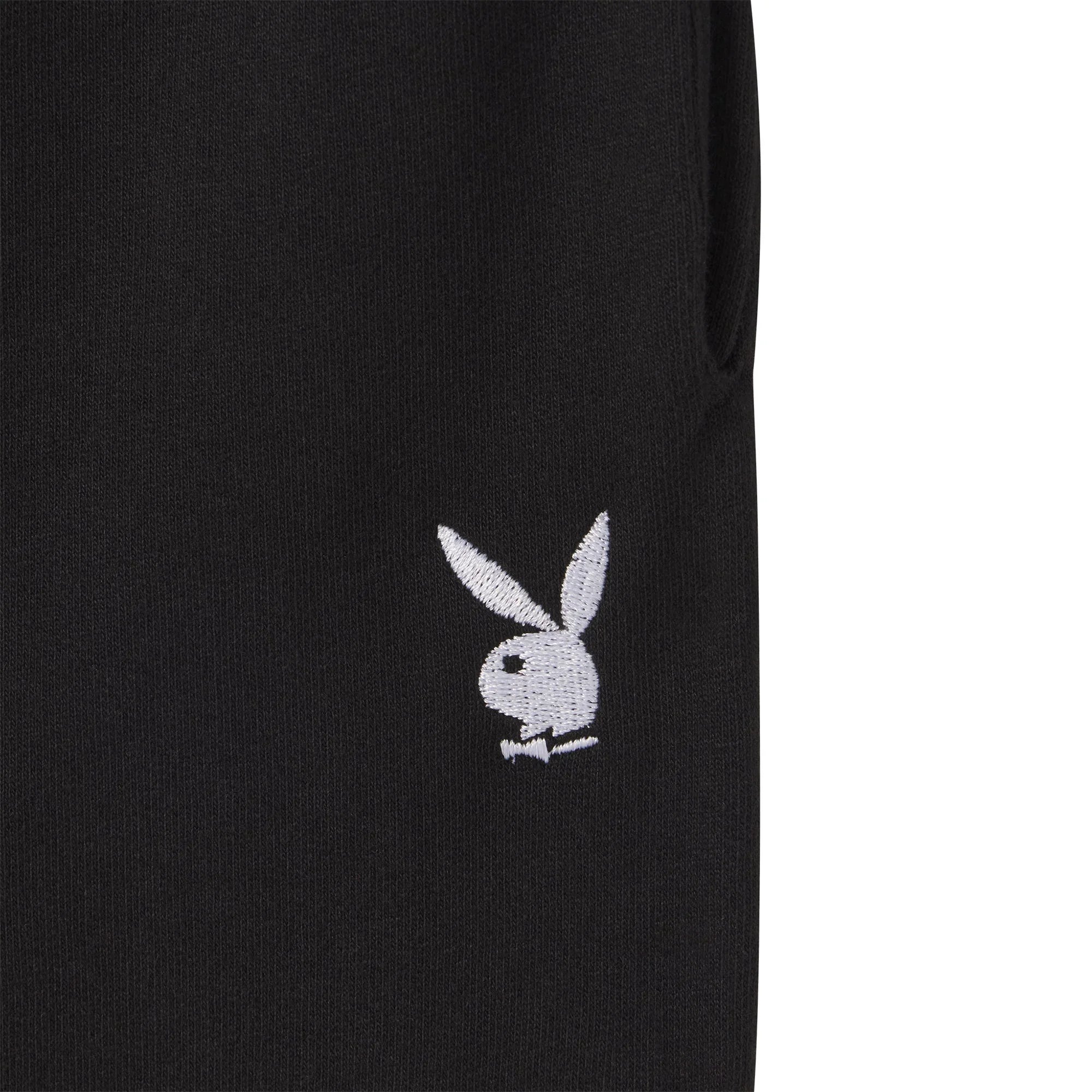 Black sweatshorts with embroidered white bunny logo on leg, close-up view