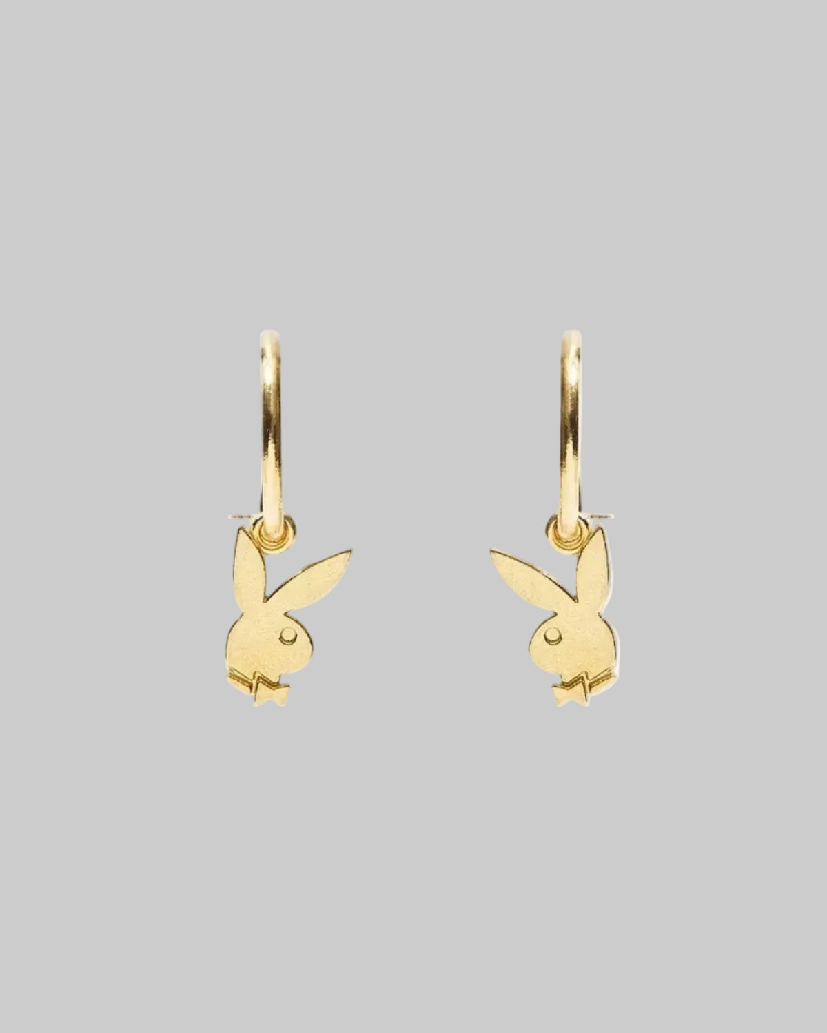 Gold-tone bunny hoop earrings with dangling rabbit charms on a white background