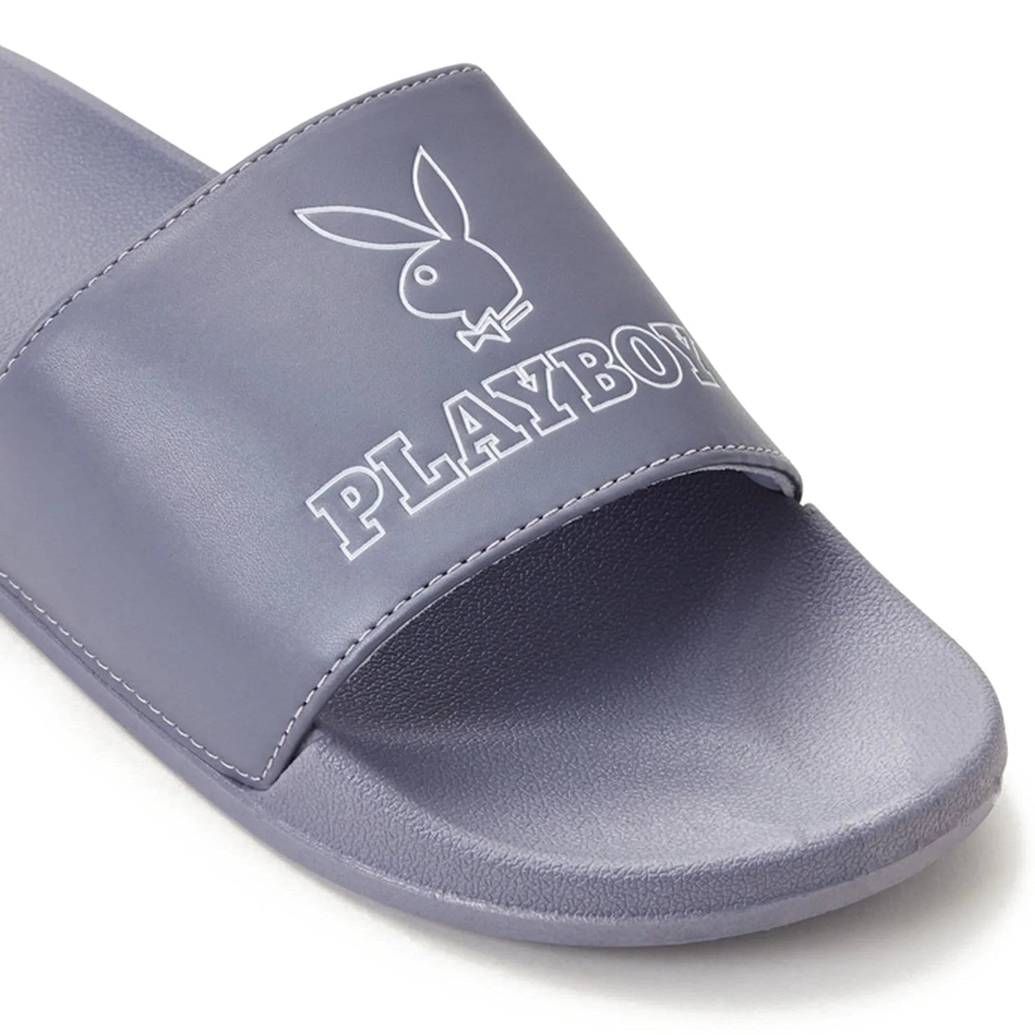 Purple slide sandal with bunny logo and text on the strap, casual footwear closeup