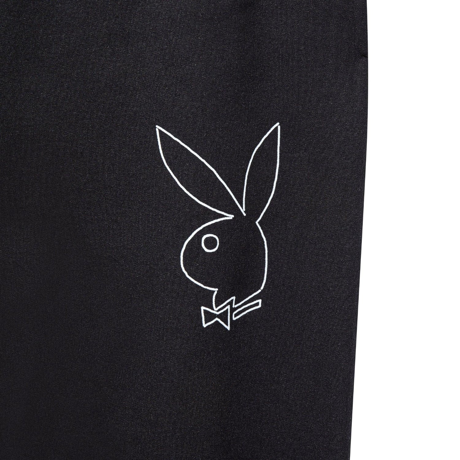 Black sweatpants with a white bunny outline graphic on the leg
