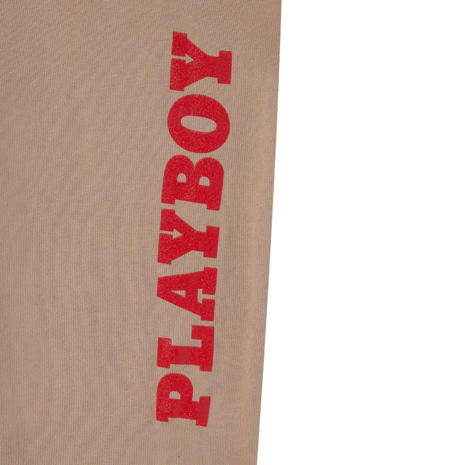 Tan sweatpants with bold red PLAYBOY text printed vertically on leg