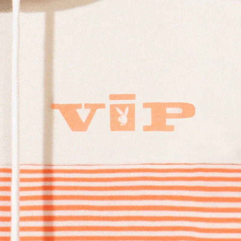 Cream and orange striped quarter-zip hoodie with VIP logo and bunny graphic detail