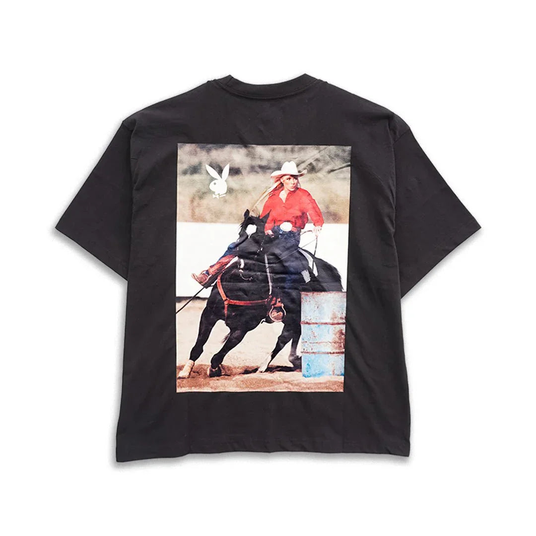 Black boxy tee with graphic of woman in cowboy hat riding horse, rodeo print on back