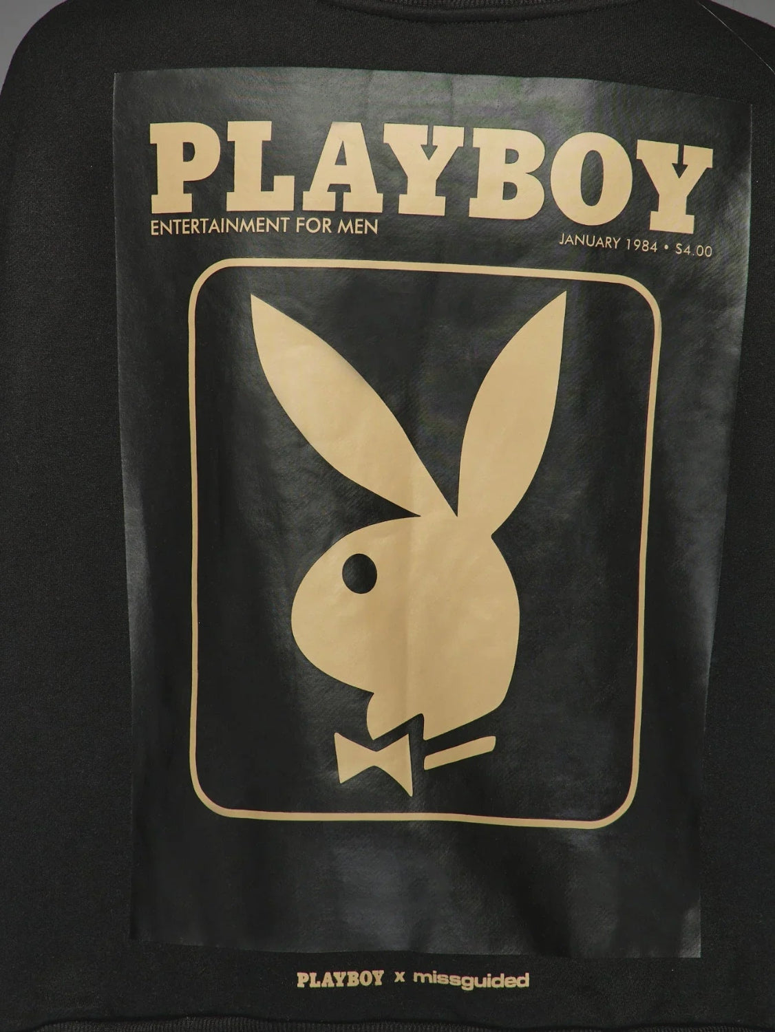 Black sweatshirt with gold January 1984 magazine cover graphic and bunny logo print on back