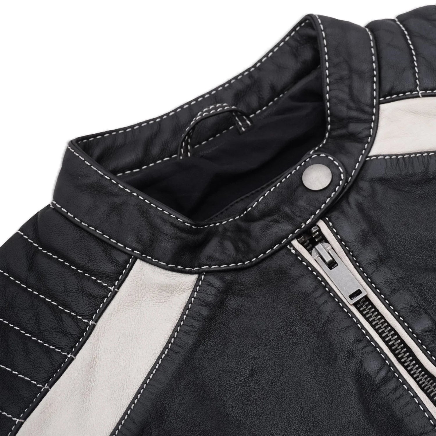 Close-up of women's black leather jacket with white panels, zipper, and contrast stitching