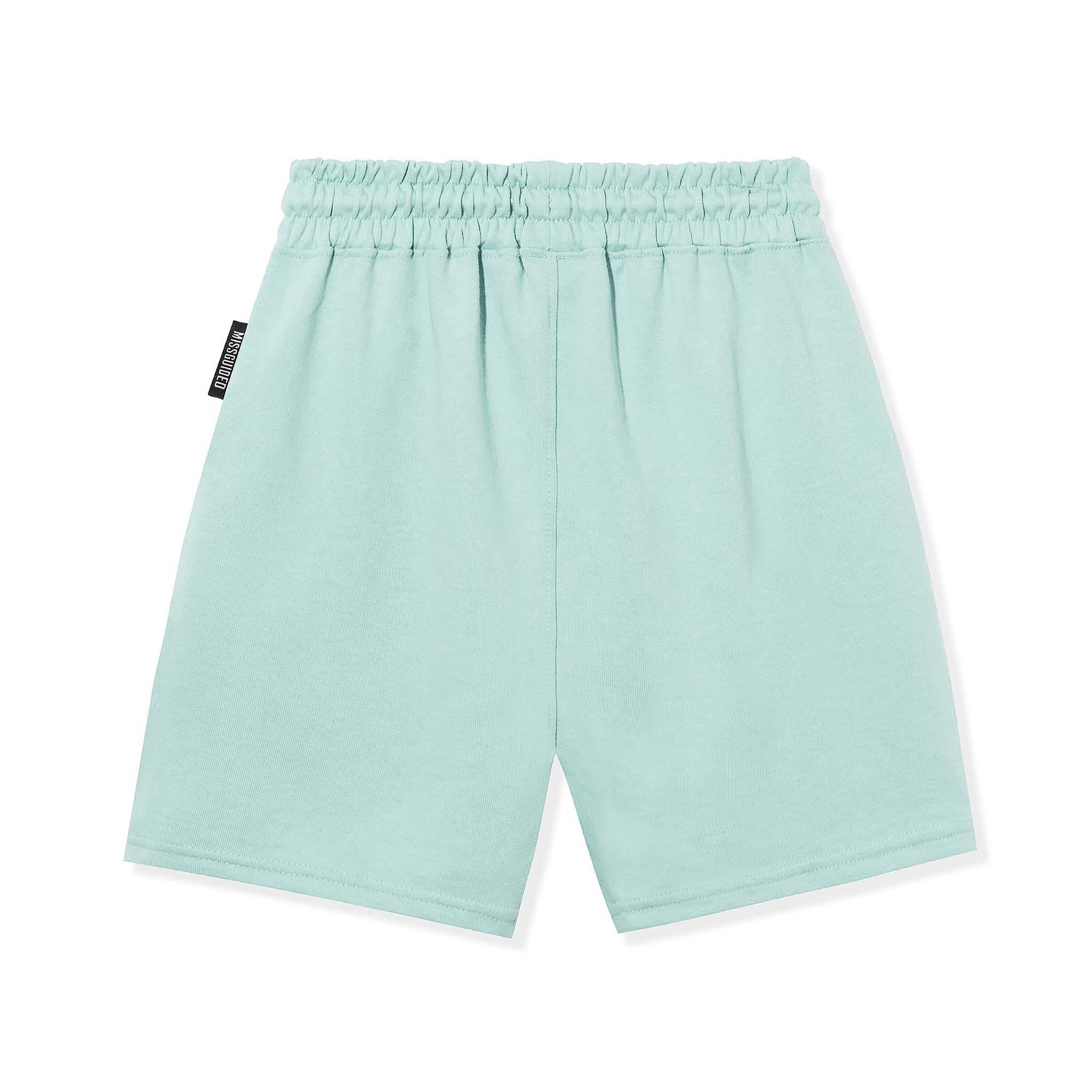 Light blue elastic waist shorts with a side tag, back view, laid flat on white background.