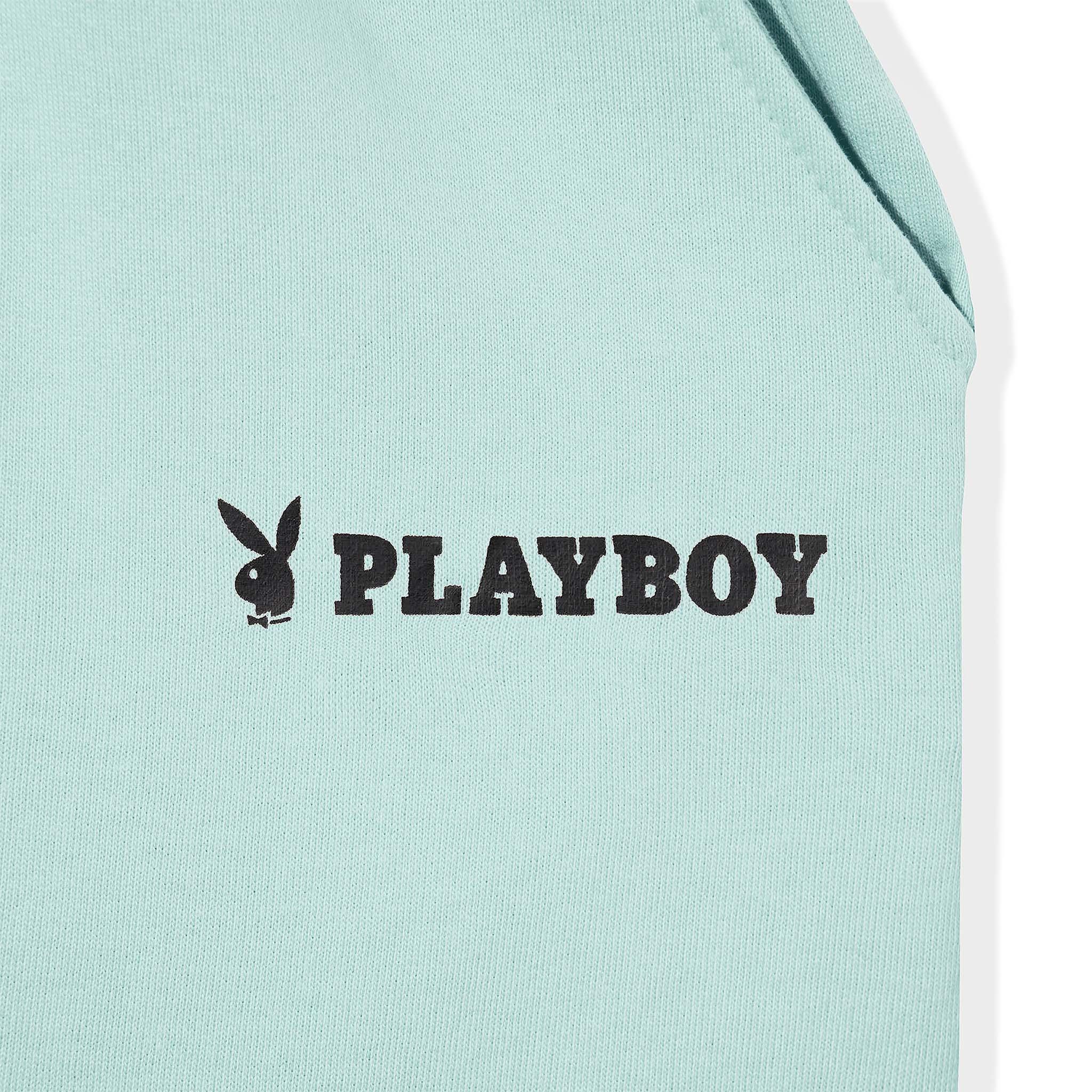 Mint green fabric with black Playboy logo and bunny graphic print detail