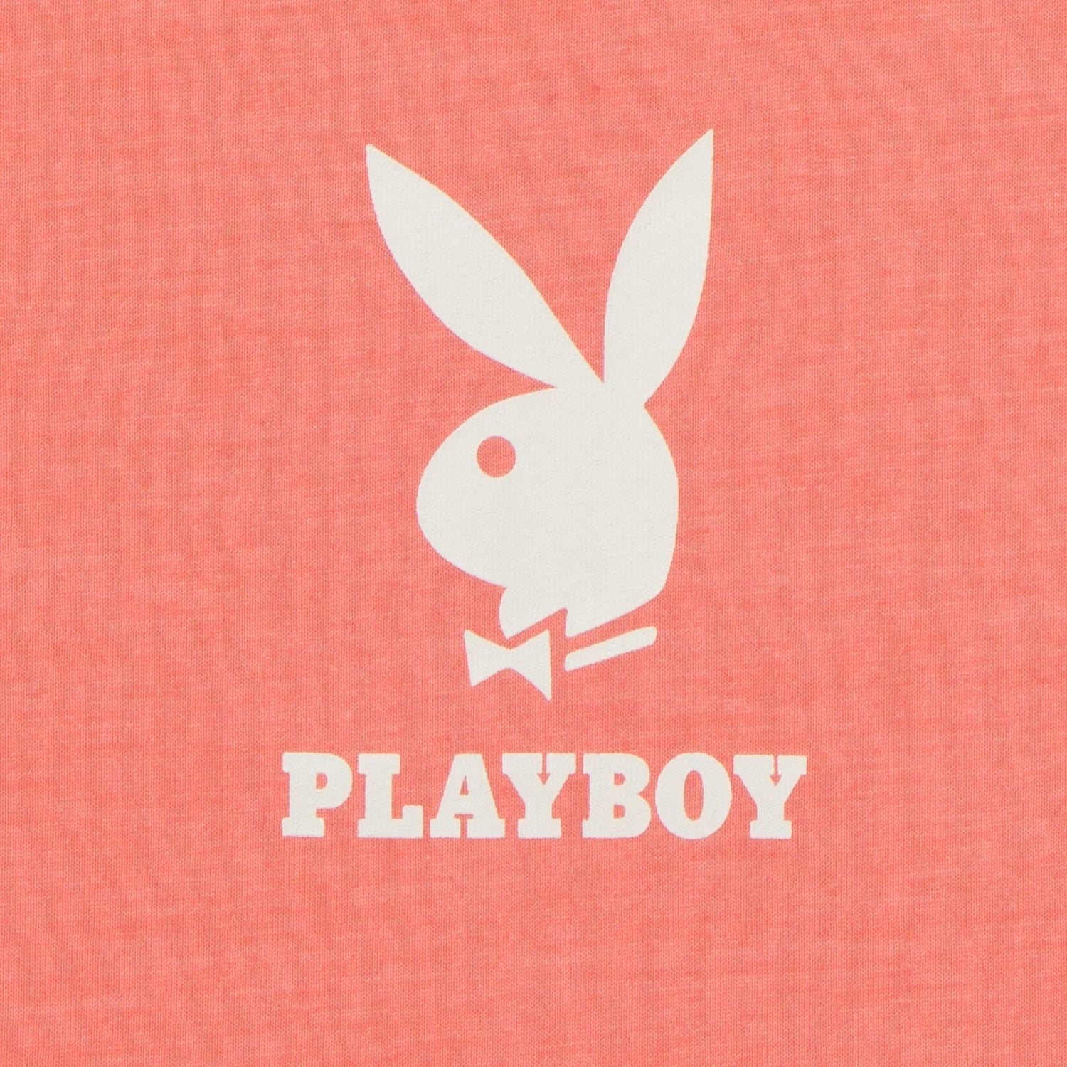 Coral oversized t-shirt with white bunny logo and PLAYBOY text on the chest