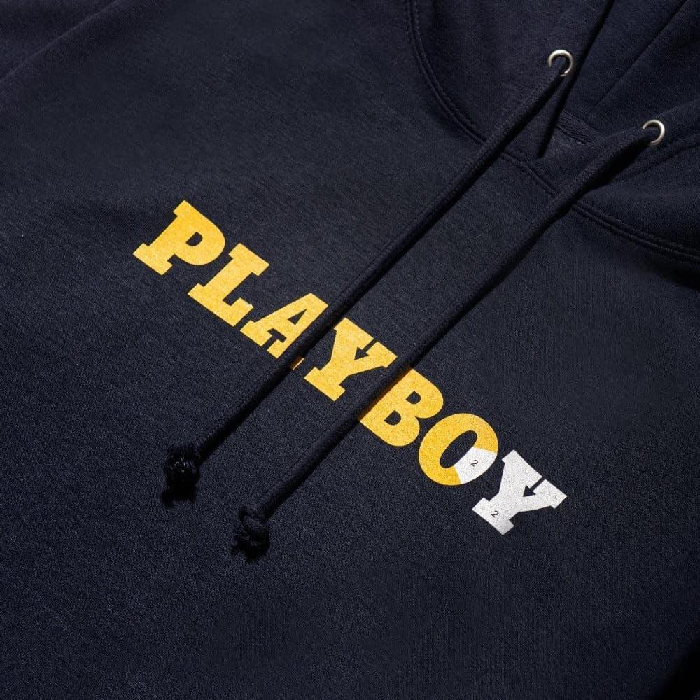 Black hoodie with yellow and white PLAYBOY text graphic on chest, drawstrings visible