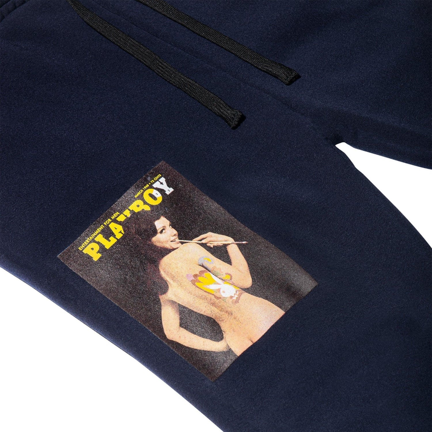 Navy joggers with vintage magazine cover graphic featuring retro painted model print