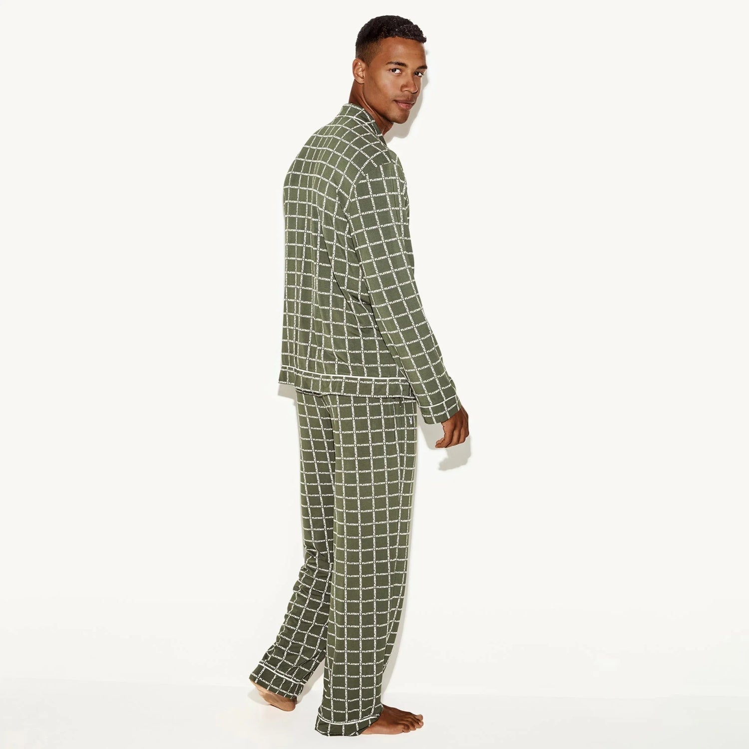 Man modeling green plaid men's classic sleep set pajamas on white background