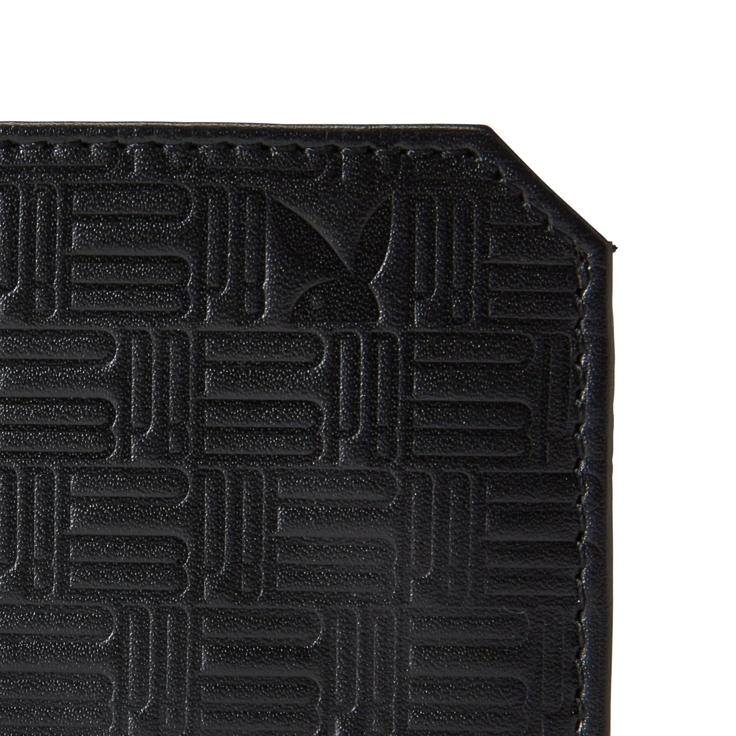 Close-up of black men's slim bifold wallet with embossed geometric pattern and corner stitching