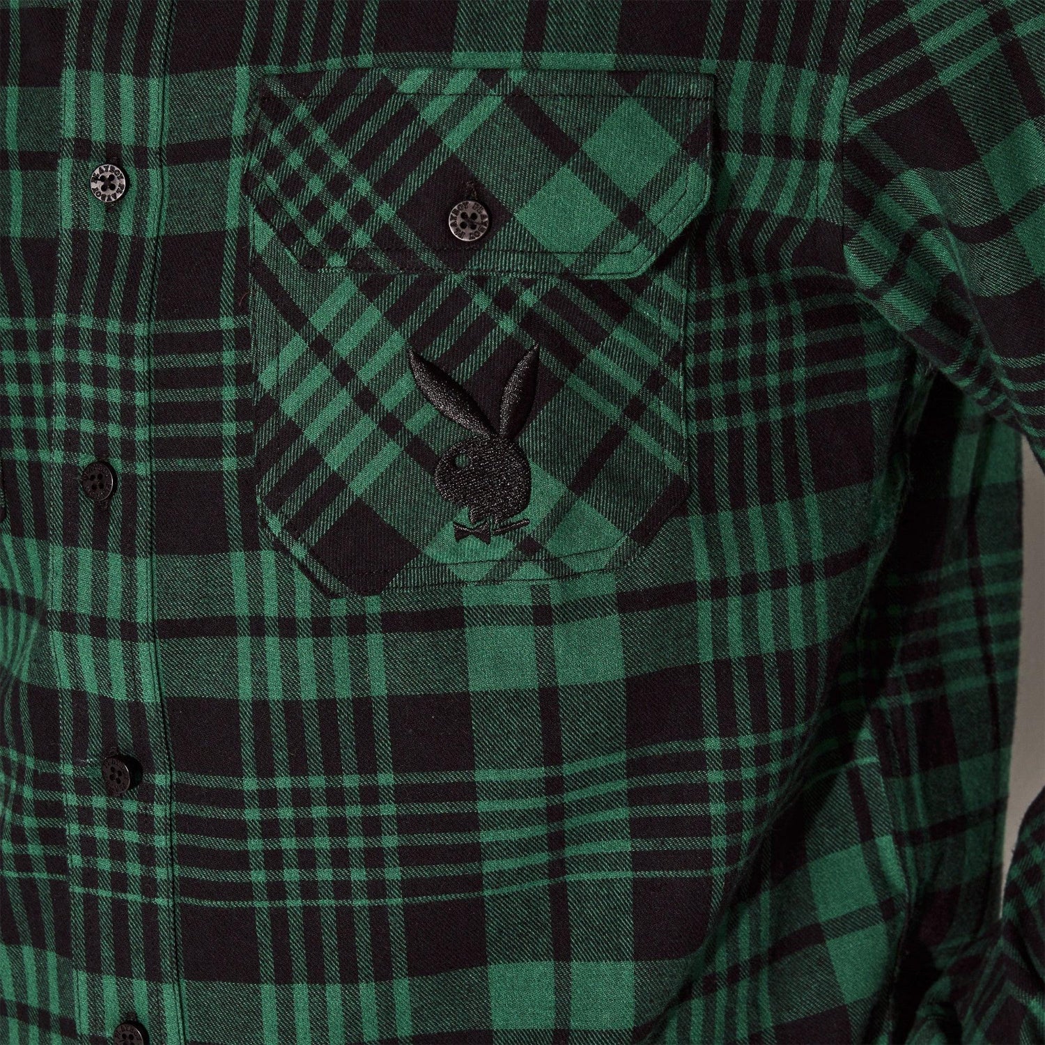 Green and black plaid men’s flannel shirt with embroidered bunny logo on chest pocket
