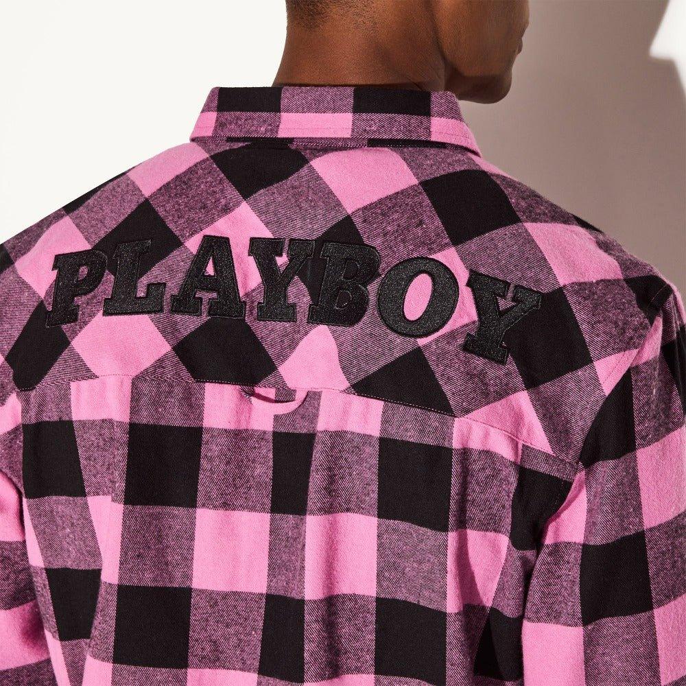 Men's pink and black plaid flannel shirt with large PLAYBOY lettering on the back