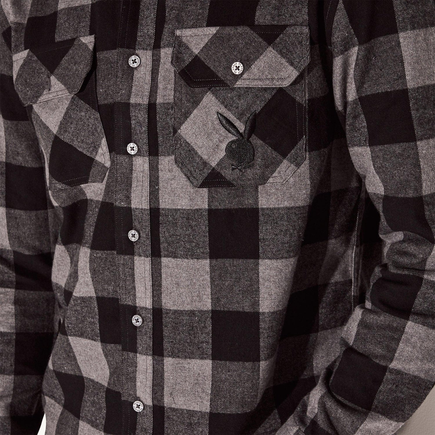 Men's black and grey flannel long sleeve shirt with front pockets and bunny logo on pocket