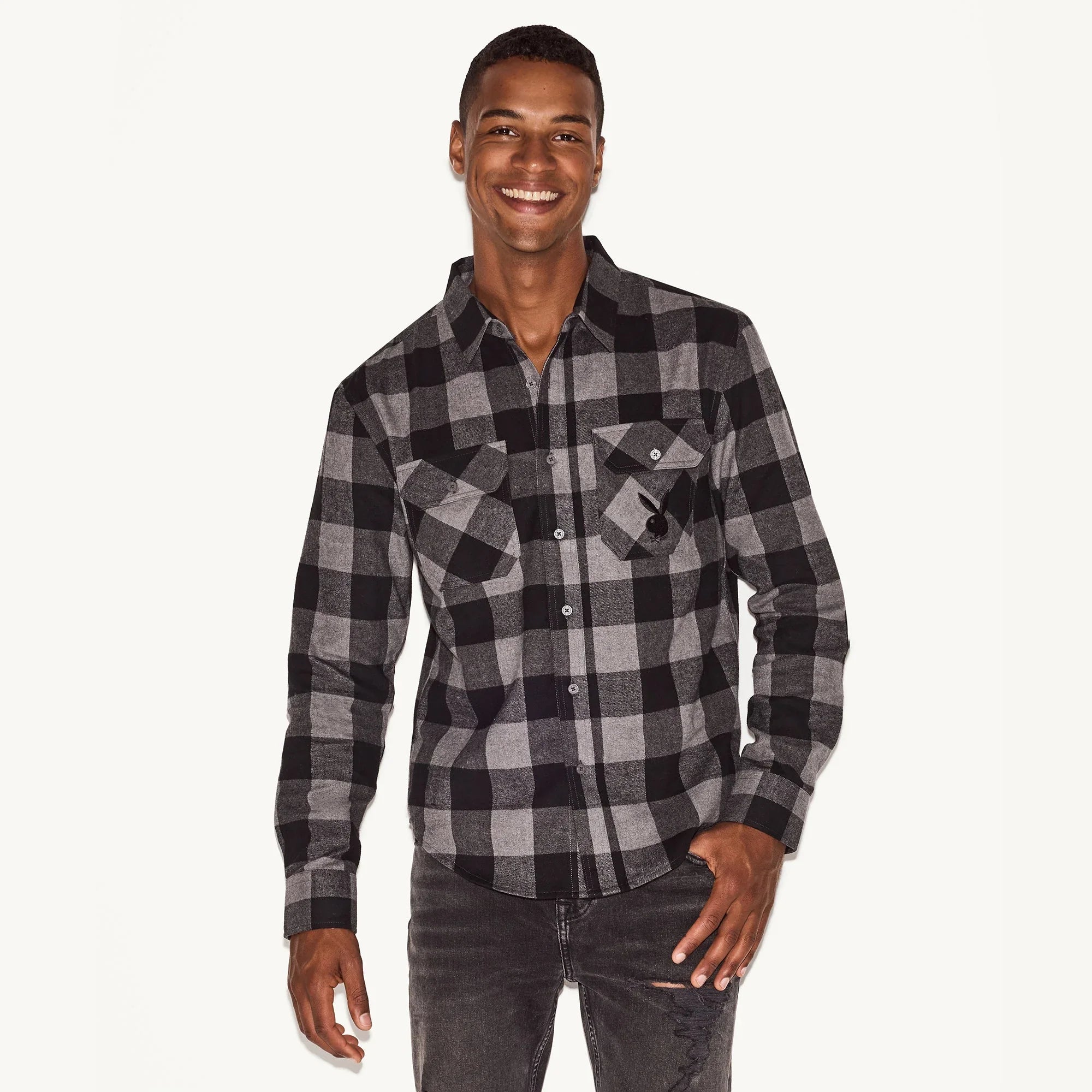 Man wearing black and grey plaid flannel long sleeve shirt with front pockets