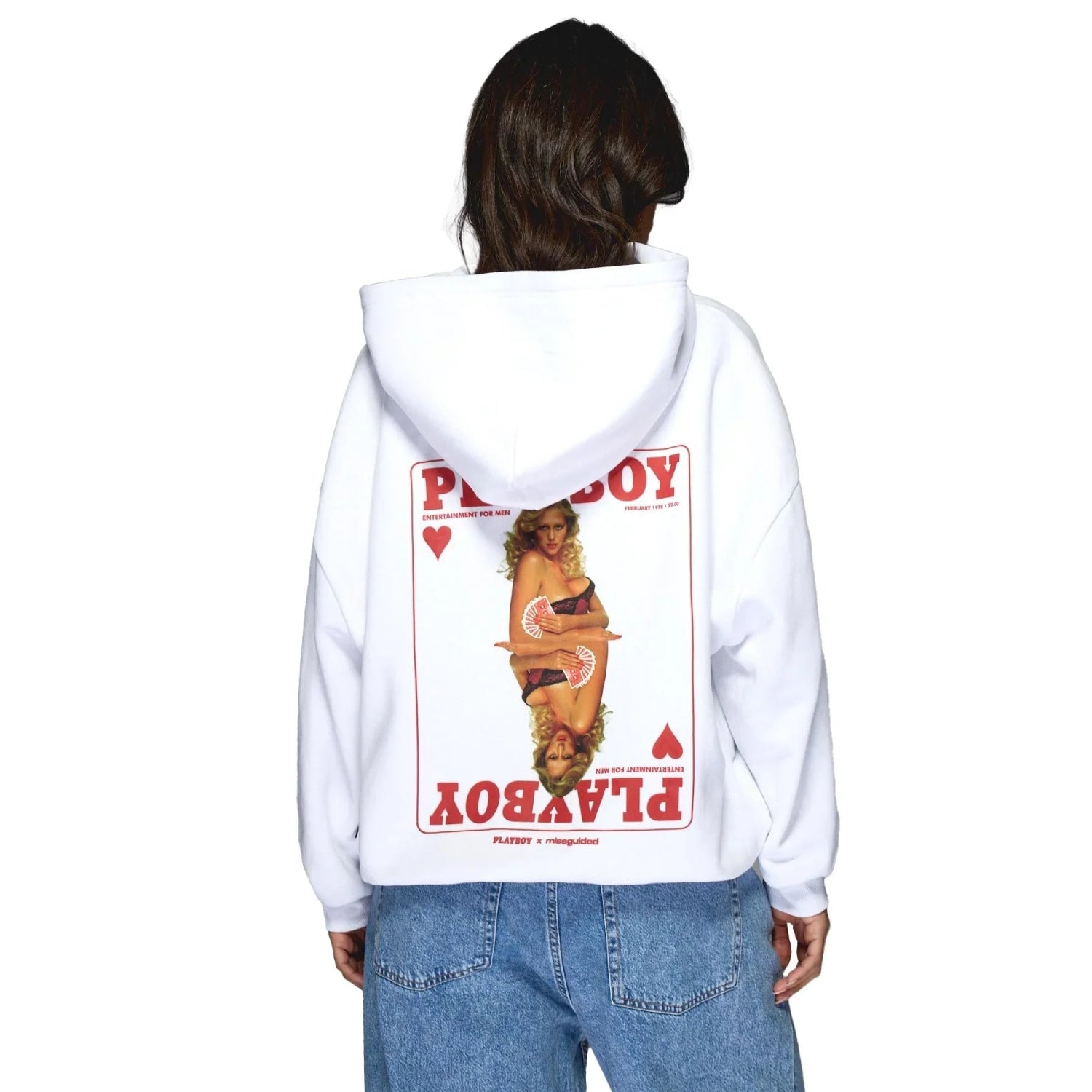 Woman wearing white hoodie with vintage playing card graphic and model print on the back