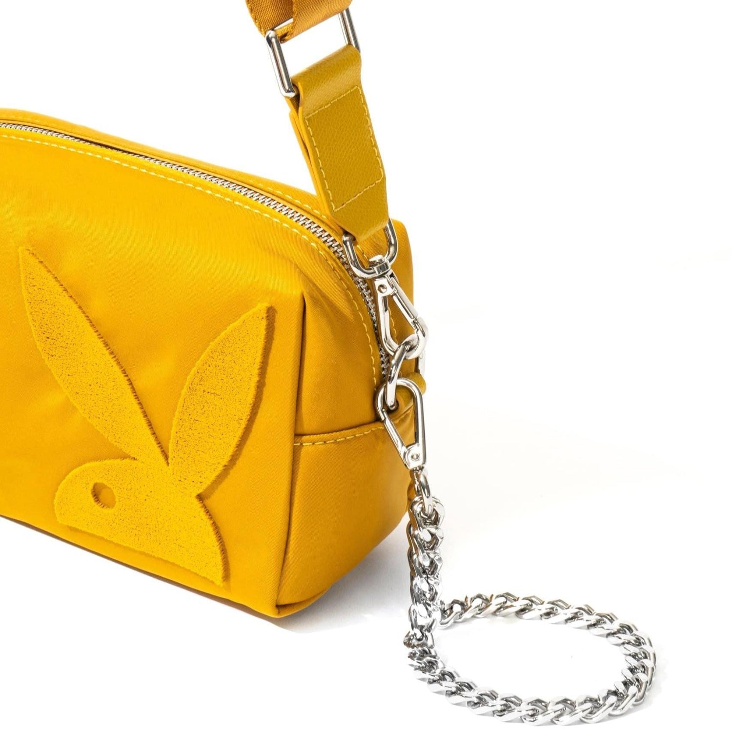 Yellow nylon crossbody bag with a raised bunny logo and silver chain strap on white background