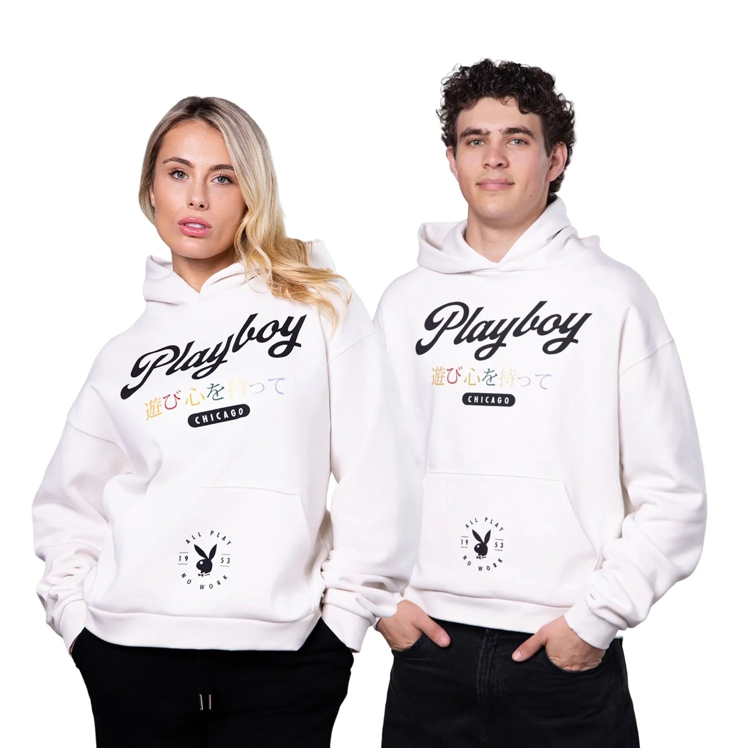 Man and woman wearing white graphic hoodies with Chicago text and Japanese characters, front view