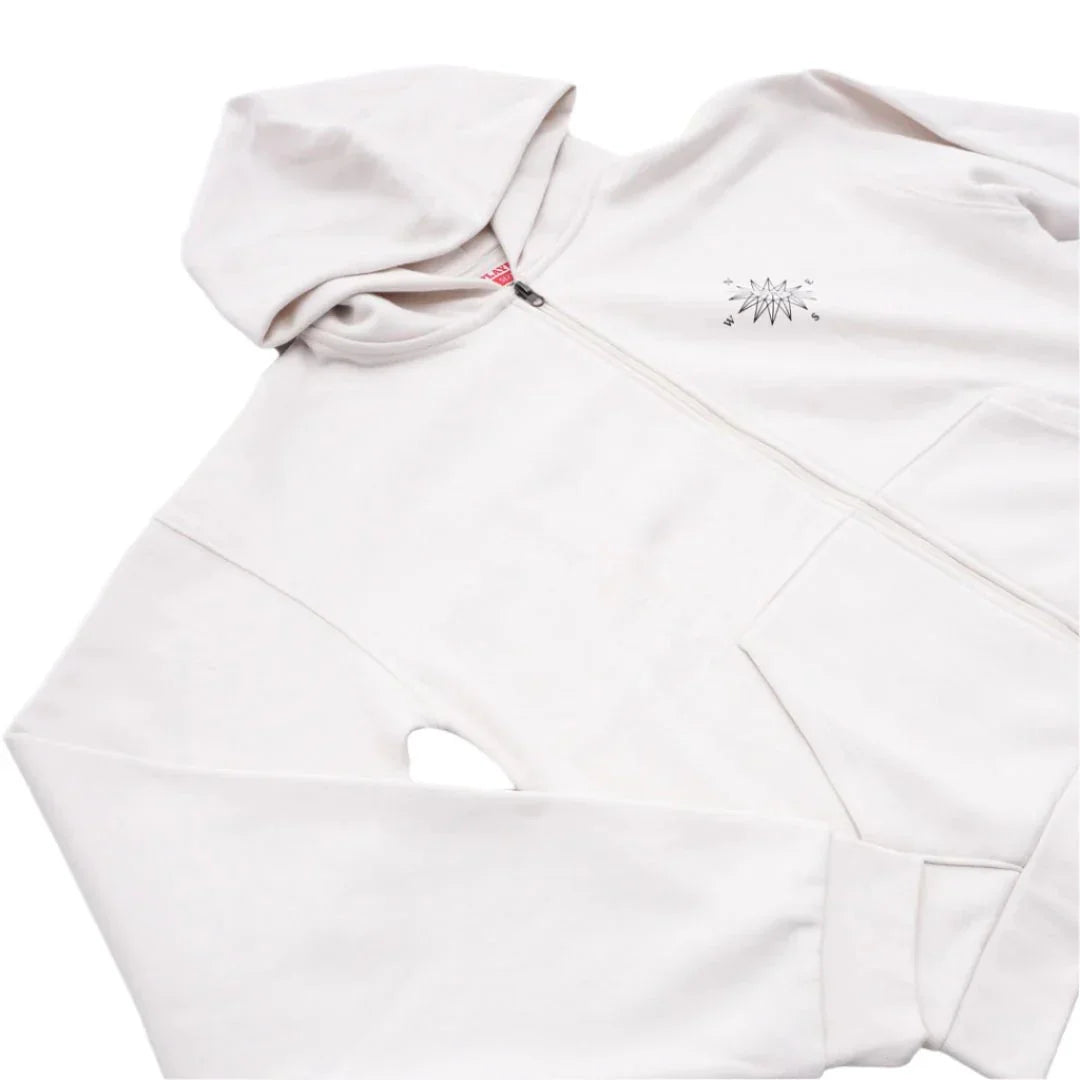 White zip-up hoodie with front pockets and small compass graphic on chest