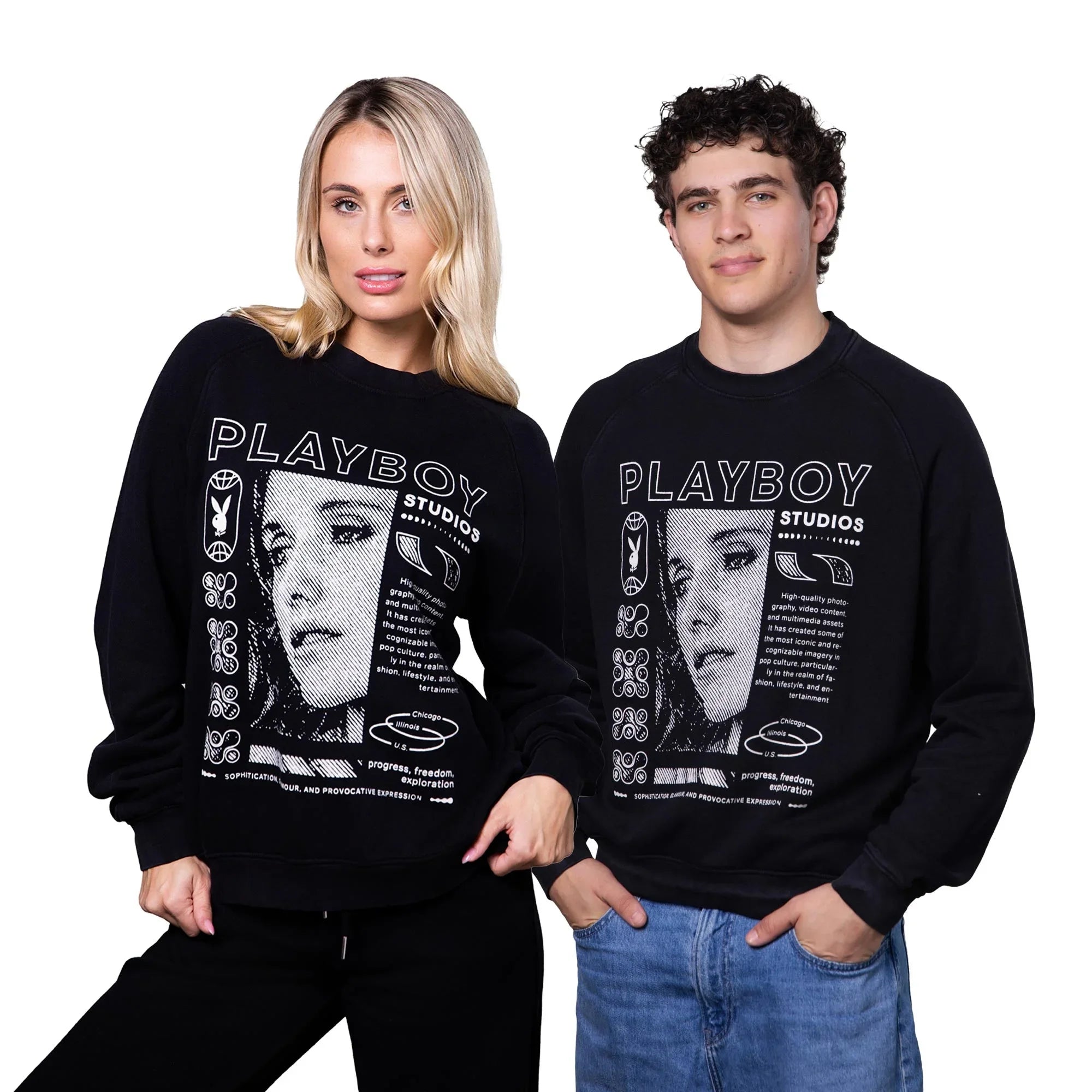 Two models wearing black graphic sweatshirts with large 'Playboy Studios' print and face design