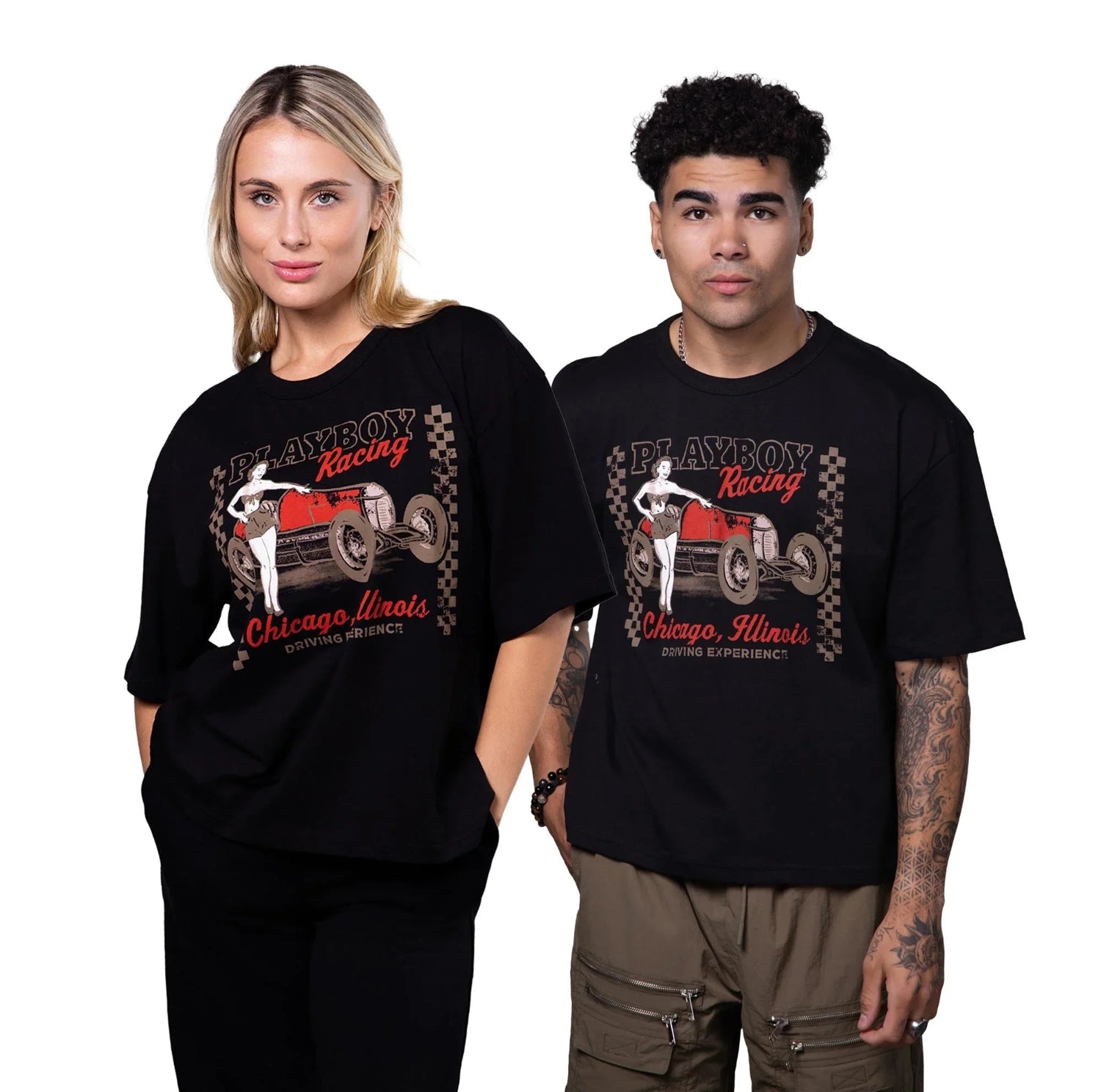Two models wearing black Chicago Racing graphic boxy tees with vintage car and pin-up print.