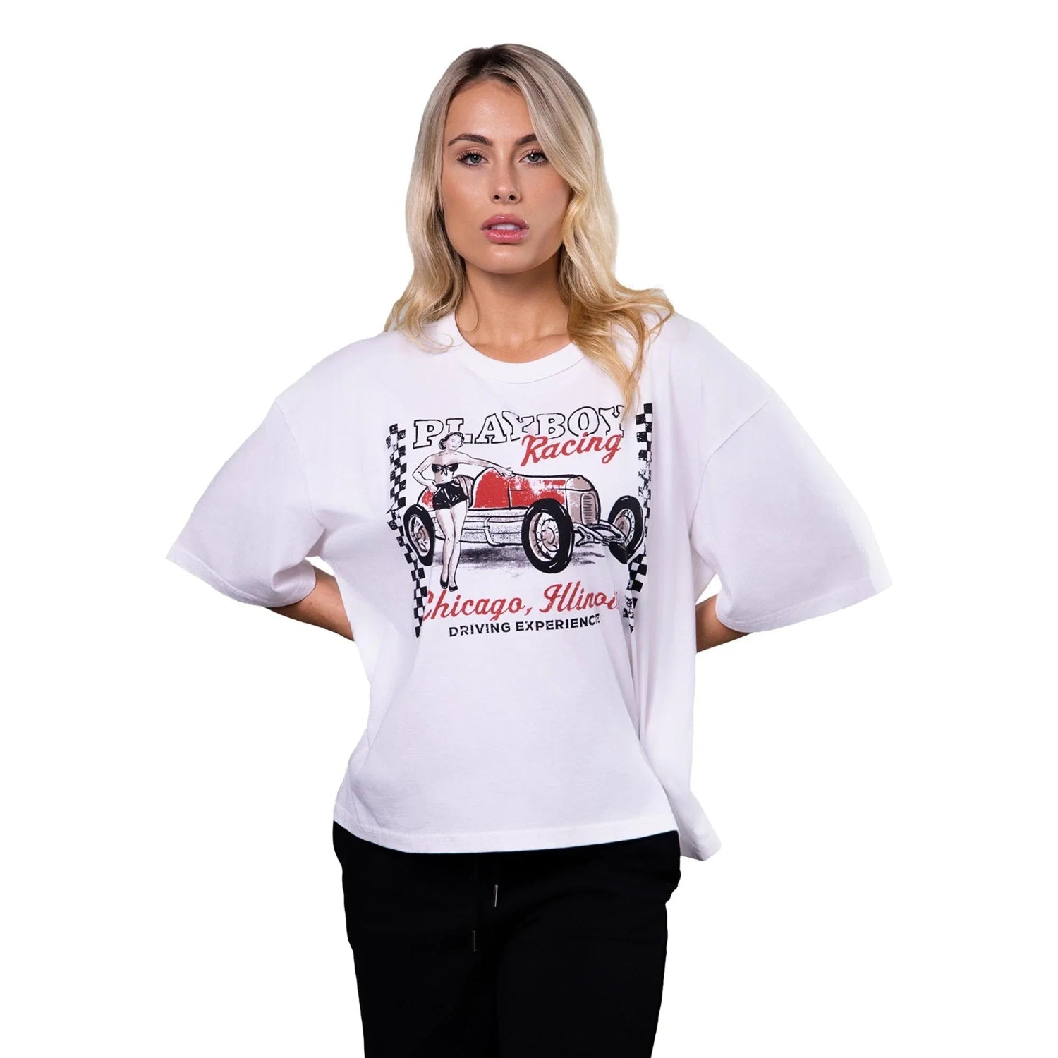 Woman wearing white boxy tee with vintage racing car and Chicago Illinois graphic print