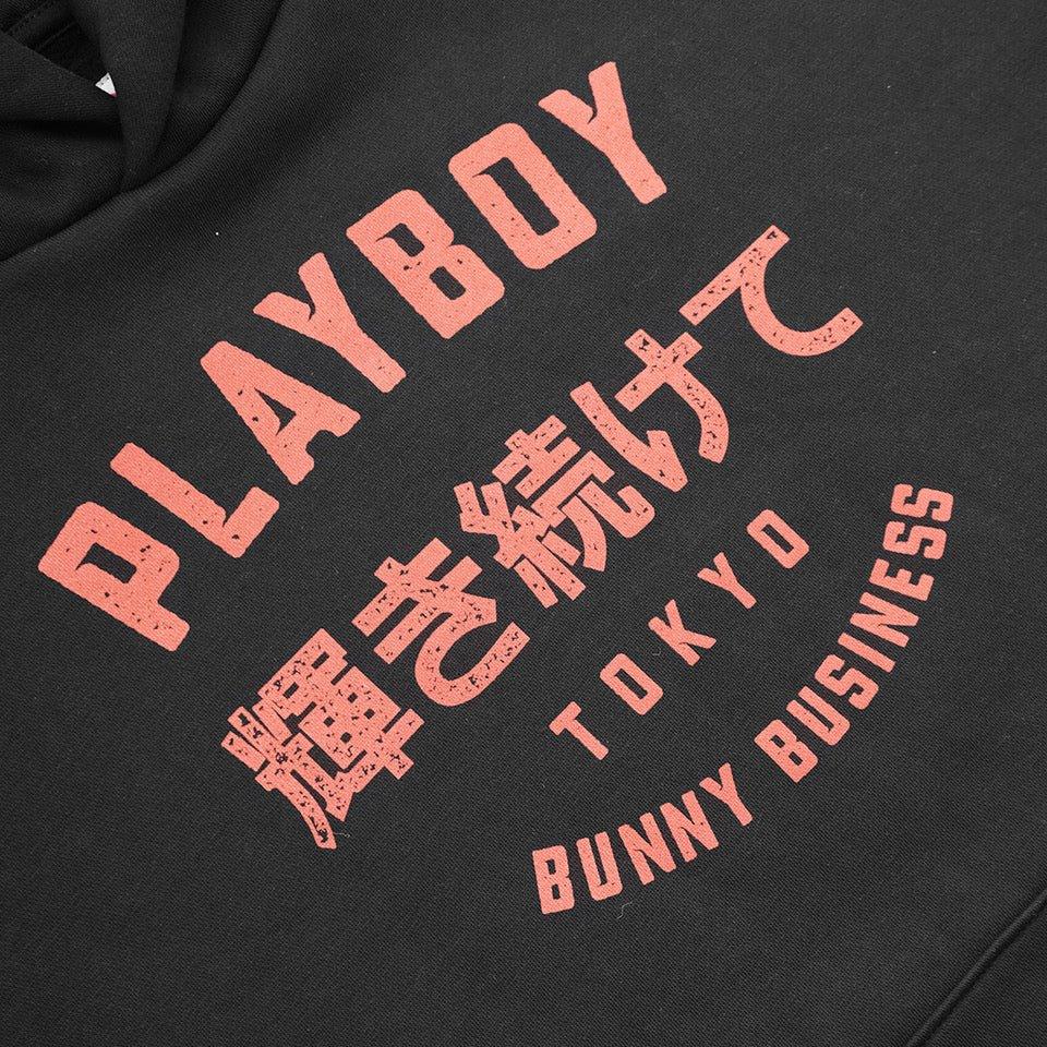 Black hoodie with bold pink text reading PLAYBOY Tokyo Bunny Business and Japanese characters