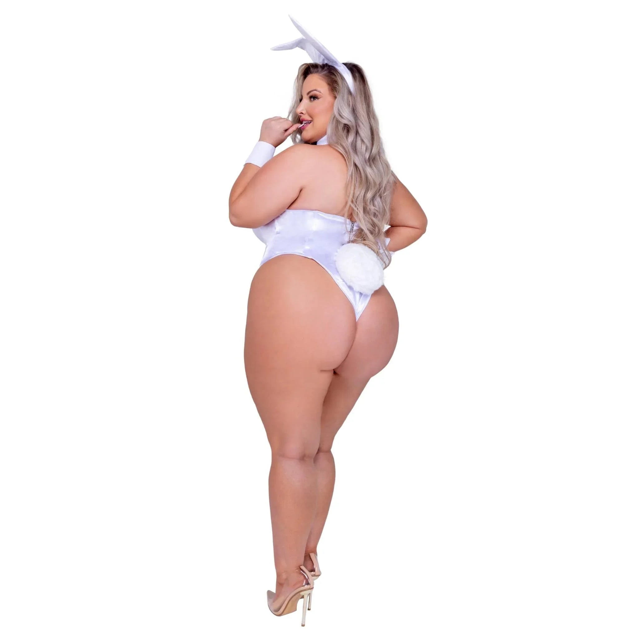 Plus size woman in white bunny costume with headband, wrist cuff, and fluffy tail.