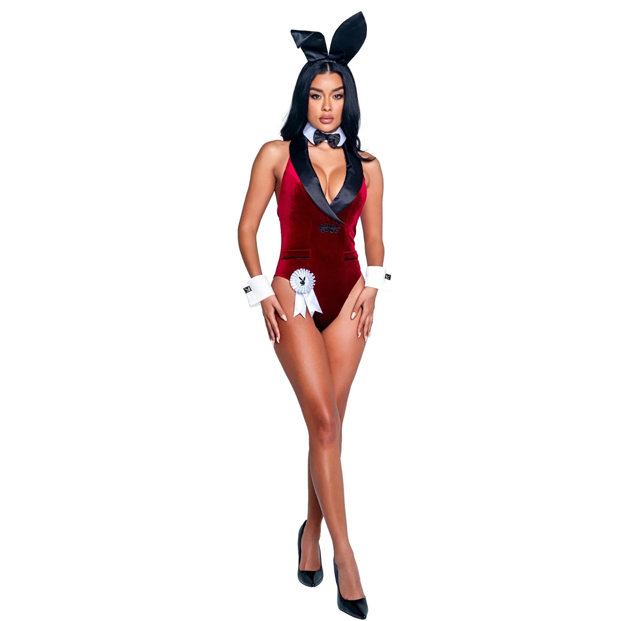 Woman in red velvet bunny costume with black bow tie, cuffs, and headband ears on white background