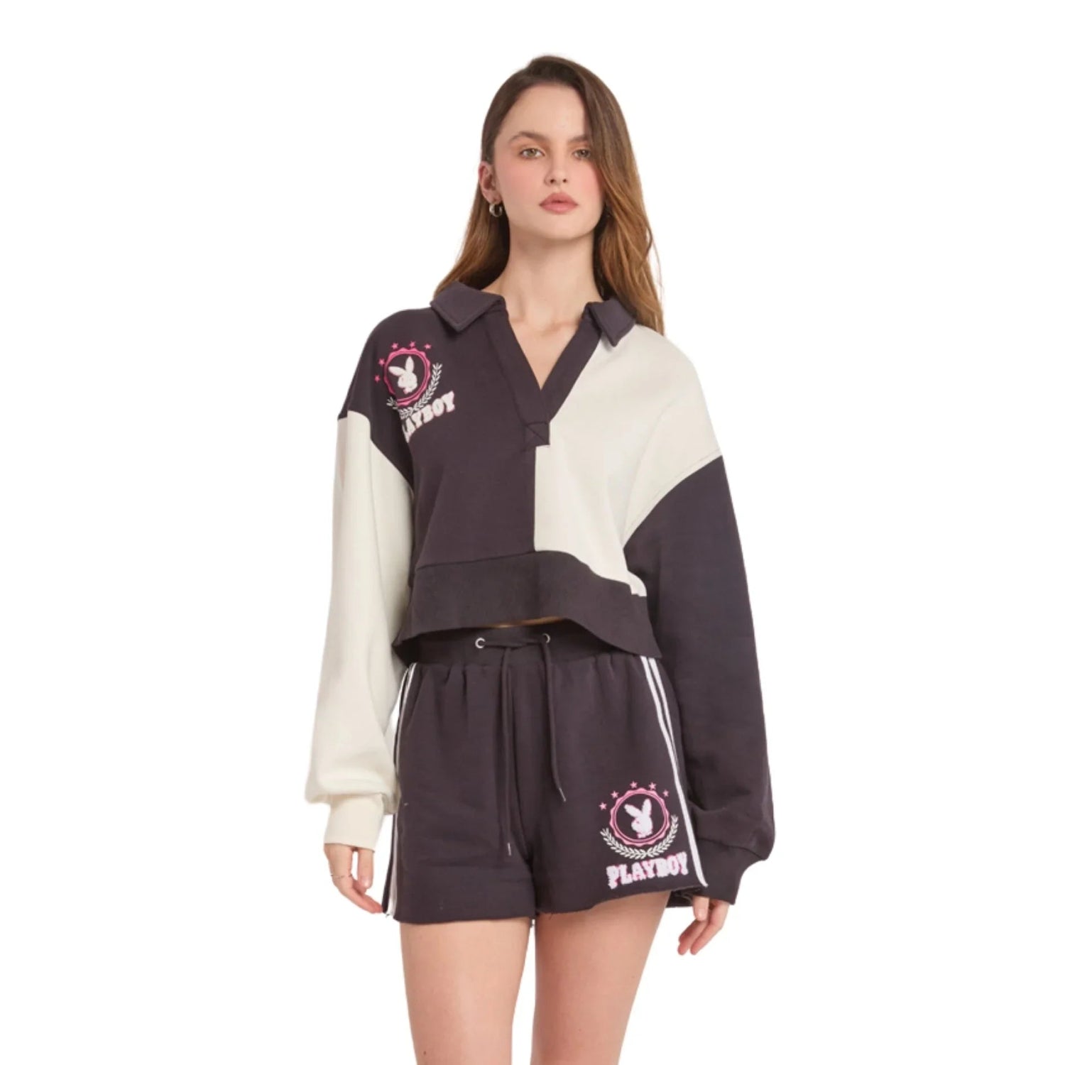 Woman wearing black and white varsity shorts with drawstring and embroidered logo, lifestyle fashion