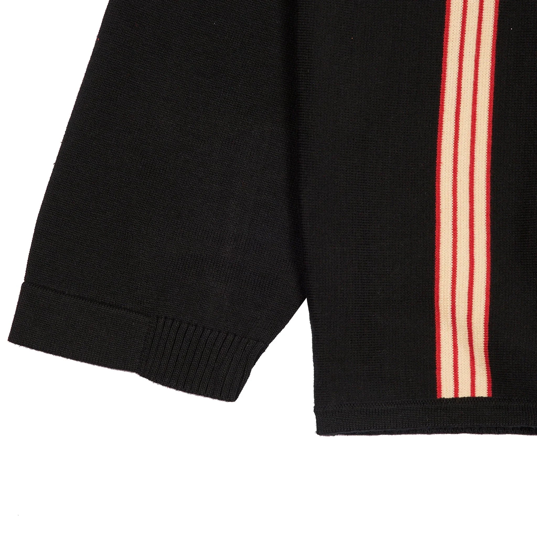 Black woven cardigan sleeve with red and beige vertical stripe detail