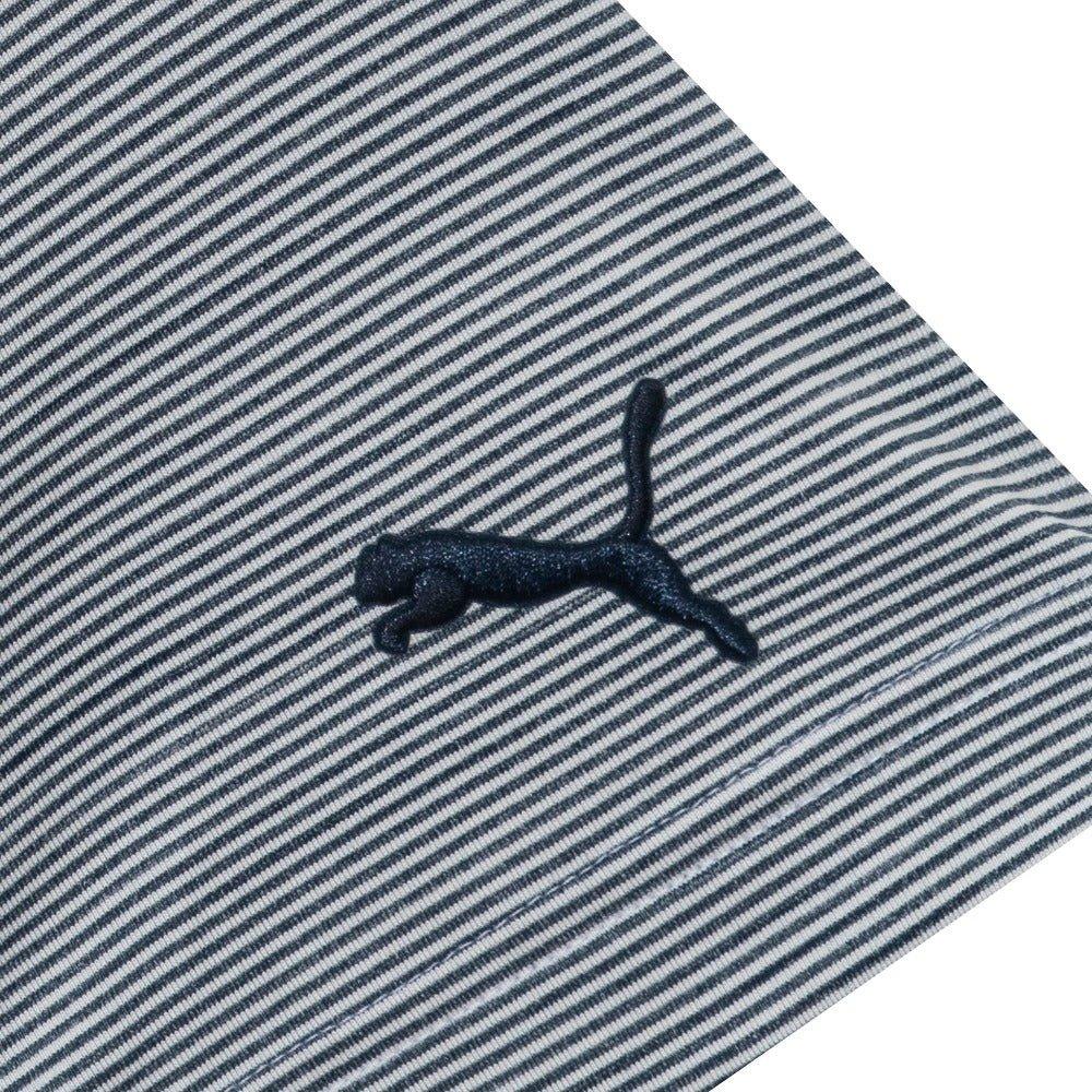Striped polo shirt fabric closeup with embroidered black puma cat logo