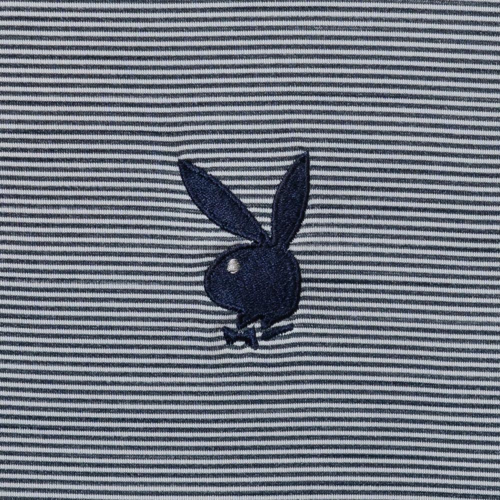 Navy bunny logo embroidered on grey and white striped polo fabric close-up