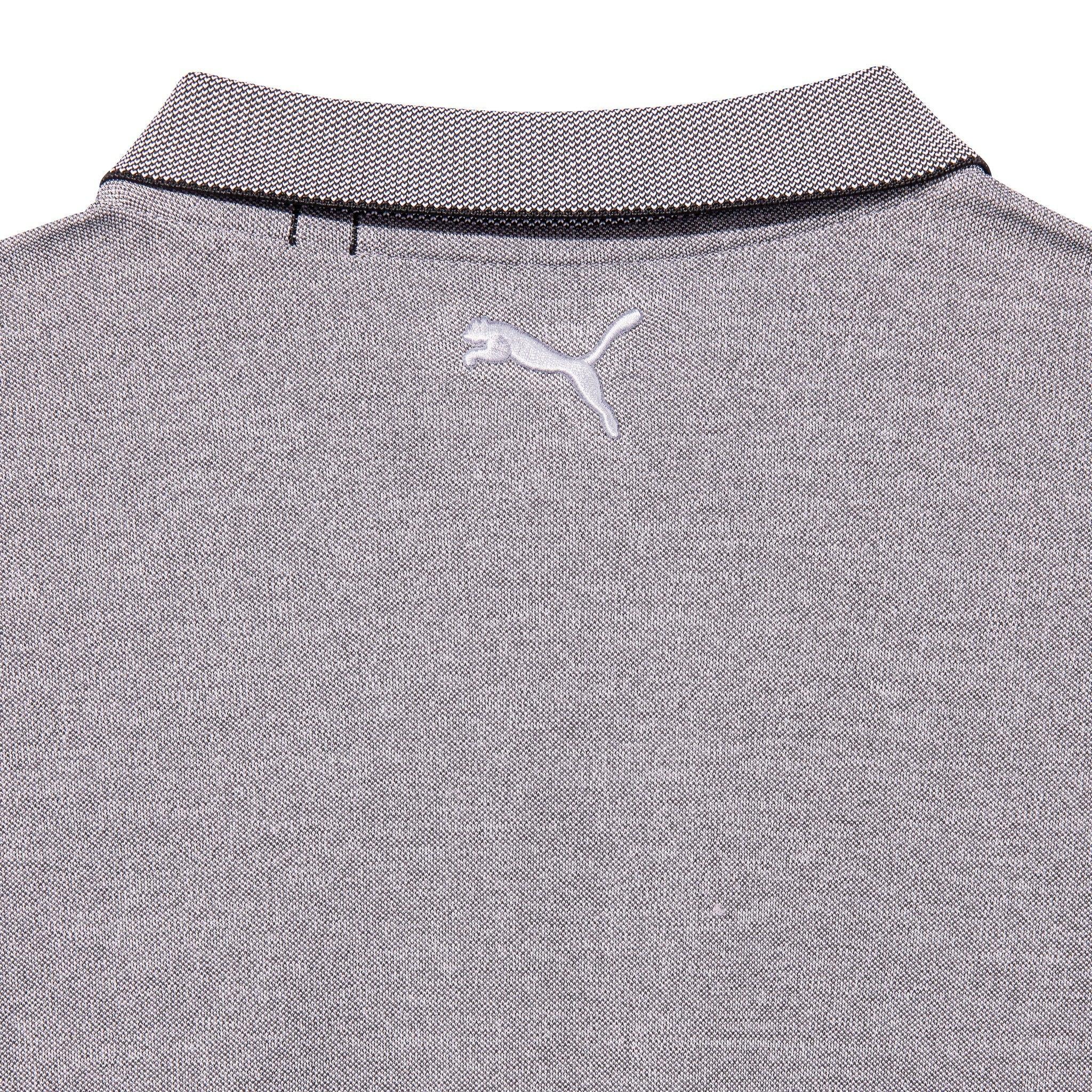 Close-up of grey pique performance polo shirt with tipped collar and embroidered logo on back