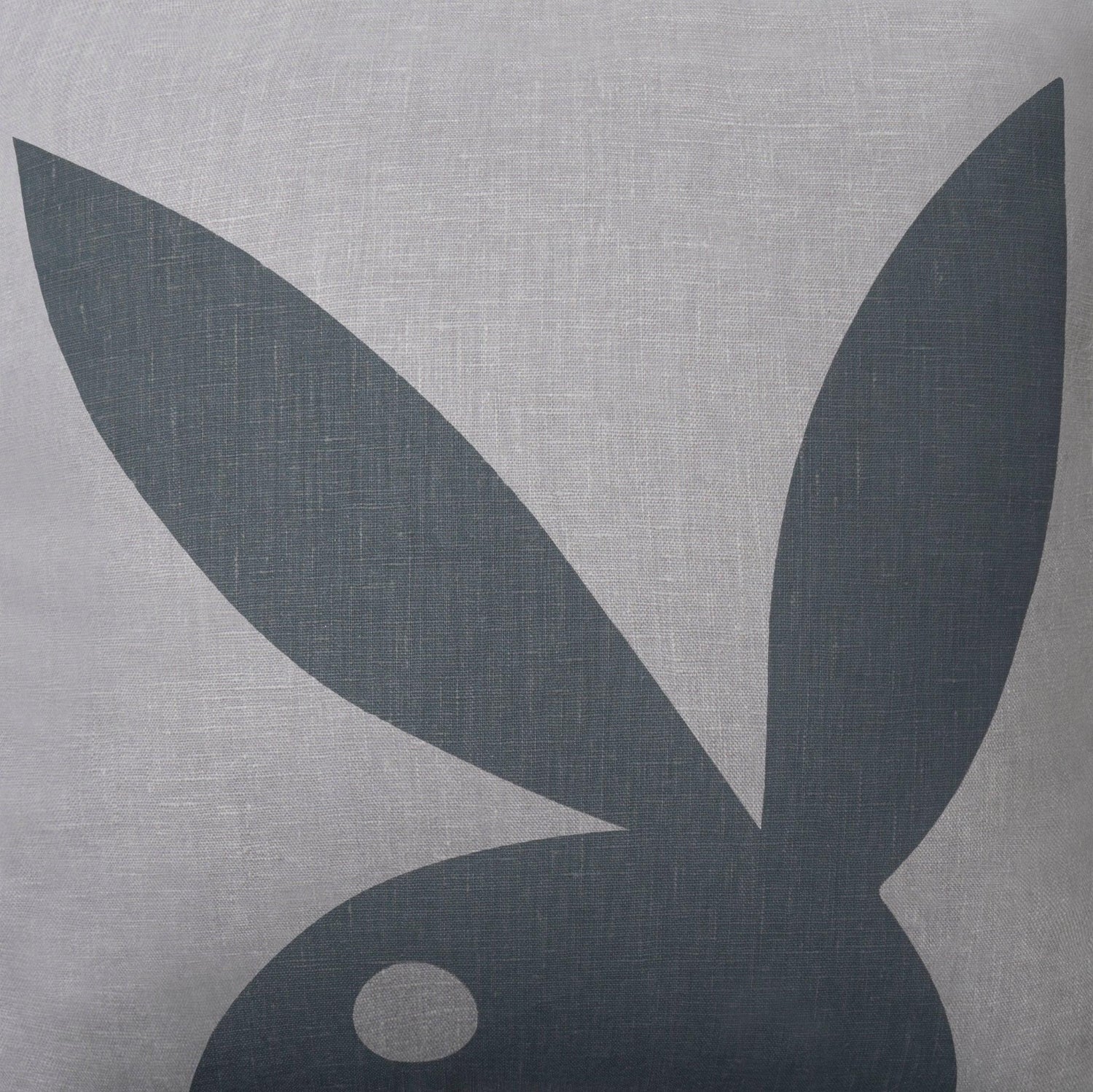 Gray decorative pillow with bold black bunny silhouette graphic, linen texture, close-up view
