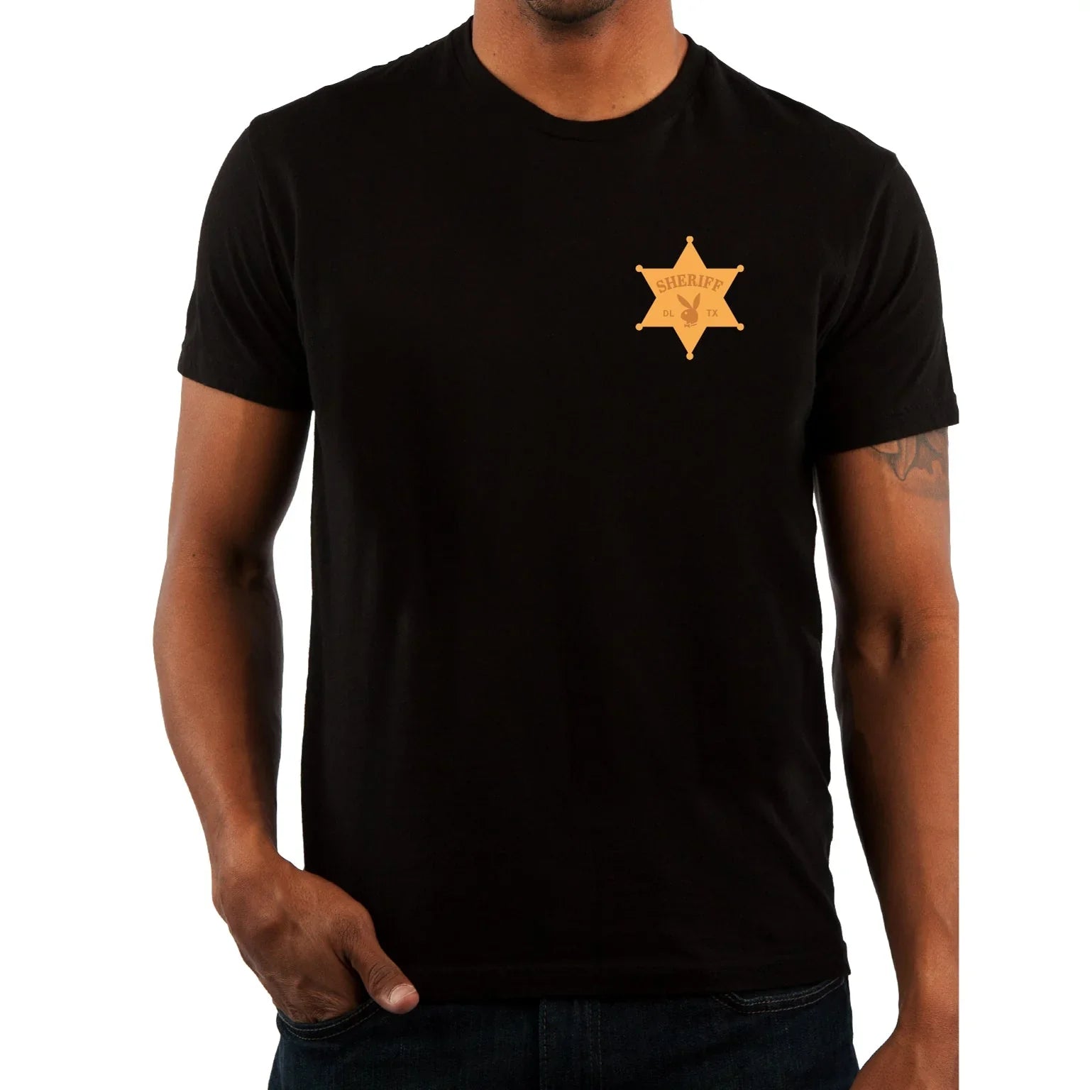 Black t-shirt with gold sheriff badge graphic on chest, worn by male model