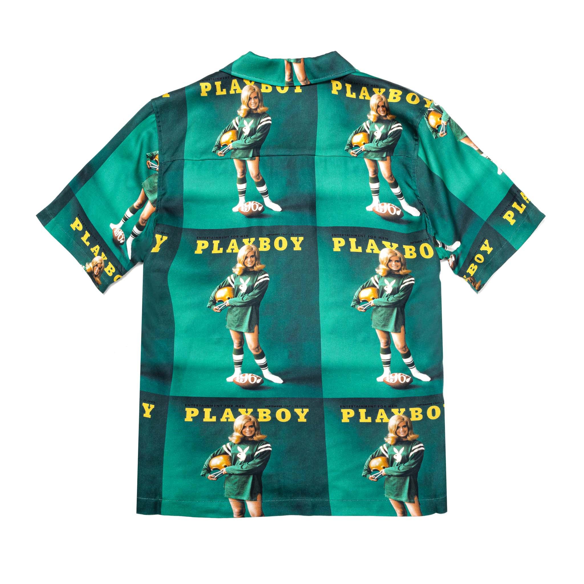Green camp shirt with retro football-themed Playboy print, short sleeves, and button-up design.