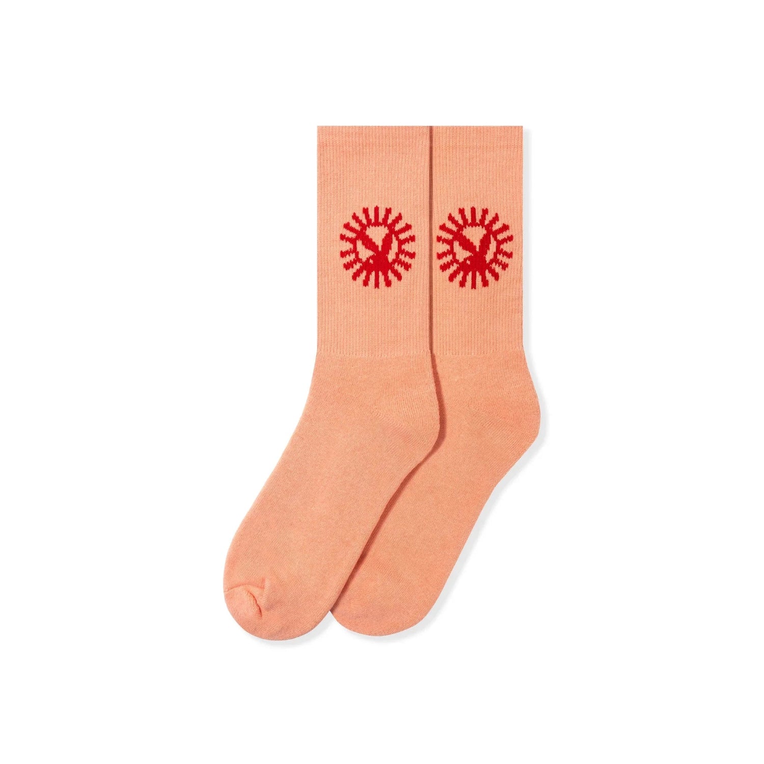 Peach crew socks with red sunburst graphic on cuffs, displayed on white background.